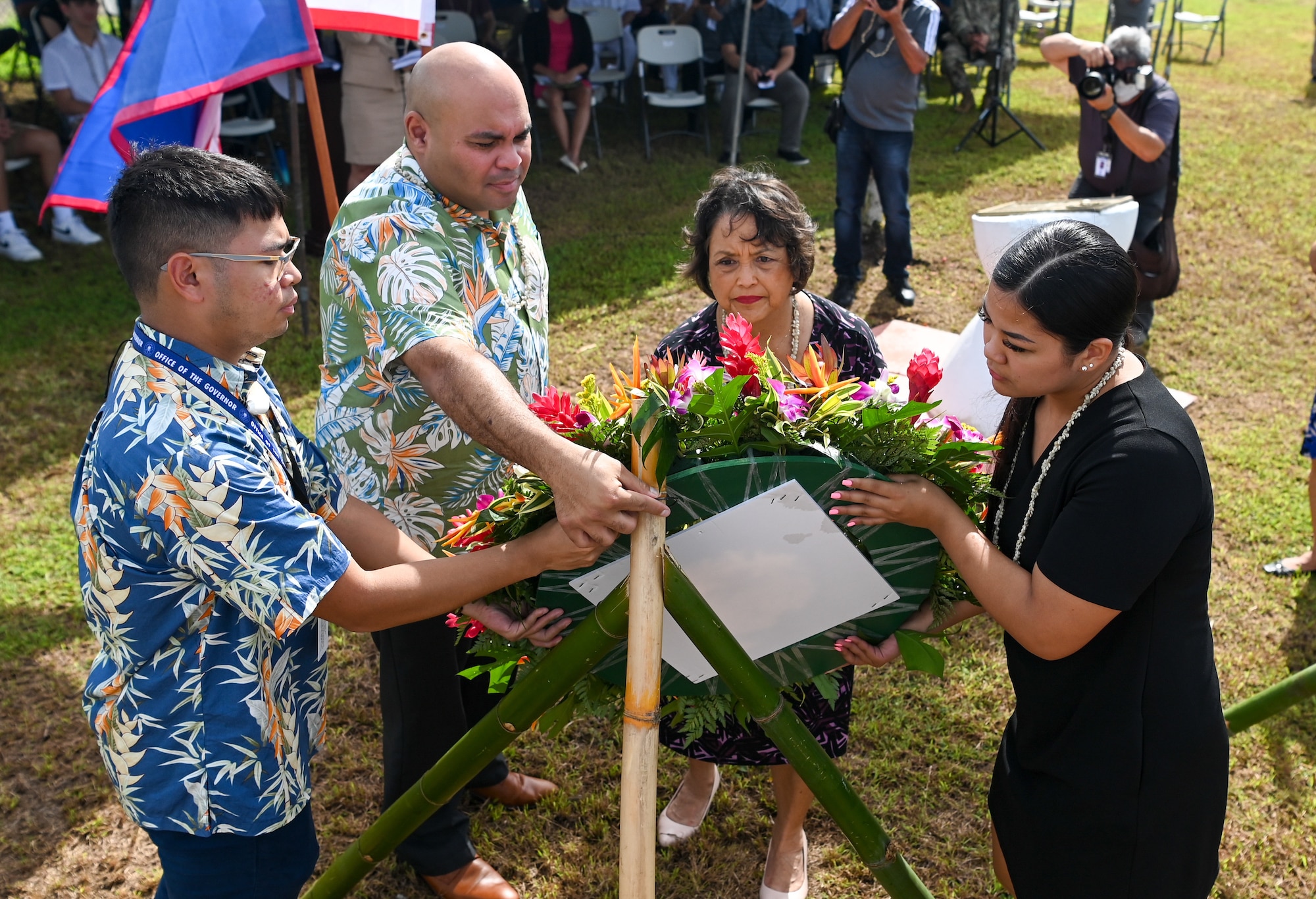 Gov. Lou Leon Guerrero of Guam and Lt. Gov. Josh Tenorio, lay a wreath during the Hasso Monmong-Toto-Maite Marine Depot Memorial Ceremony in Maite, Guam on July 7, 2022.