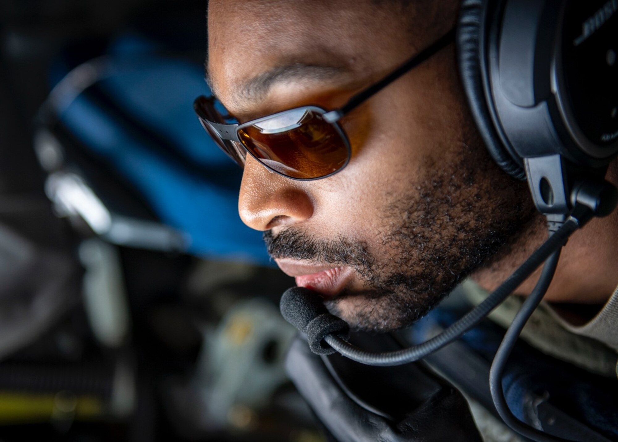U.S. Air Force Staff Sgt. Jamar Jackson, a KC-135 Startotanker aircraft boom operator assigned to the 91st Air Refueling Squadron tests new Aircrew Laser Eye Protection glasses in the boom pod of a KC-135 during a training mission over the coast of South Carolina, June 23, 2022. Jackson participated in a developmental test of the ALEP glasses conducted by the 46th Test and Evaluation Squadron from Eglin Air Force Base, Florida. (U.S. Air Force photo by Airman 1st Class Lauren Cobin)