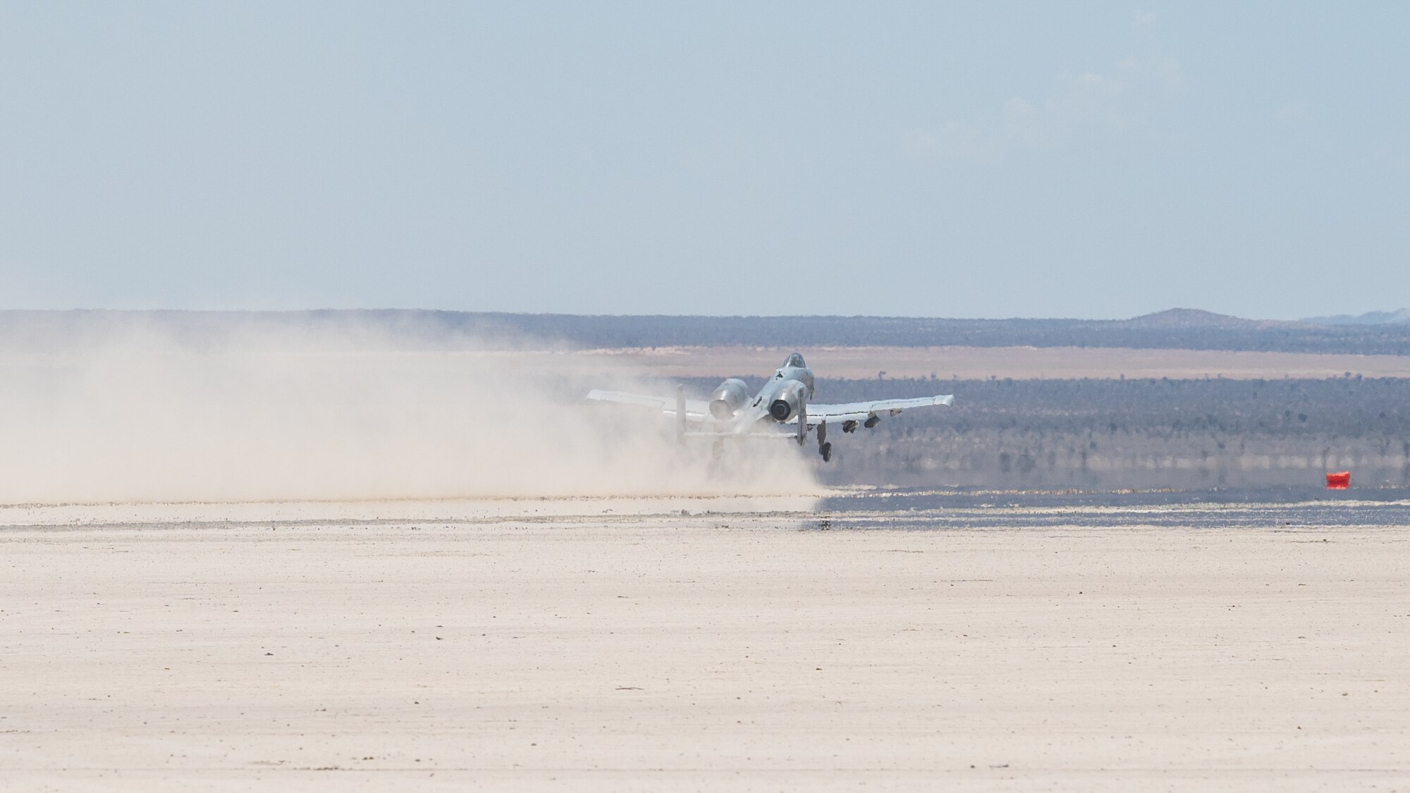 An A-10 Thunderbolt II, assigned to the 355th Wing, out of Davis-Monthan Air Force Base, Arizona, takes off from Rogers Dry Lake during an Agile Combat Employment Exercise on Edwards Air Force Base, California, June 27. The training featured Airmen from the 821st Contingency Response Squadron, out of Travis Air Force Base, California, and the 412th Operations Support Squadron based at Edwards AFB. (Air Force photo by Giancarlo Casem)