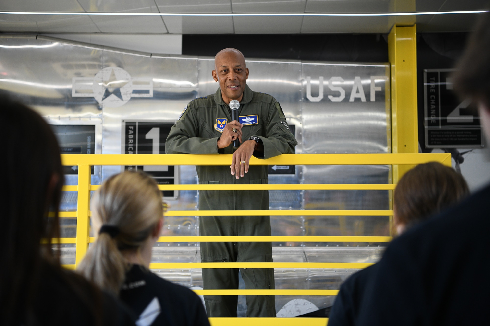 Air Force Chief of Staff Gen. CQ Brown, Jr., answers questions from future Airmen, members of the Delayed Entry Program, at a national recruiting asset called "The Hangar," at the Road America race course near Elkhart Lake, Wisconsin, July 3, 2022.