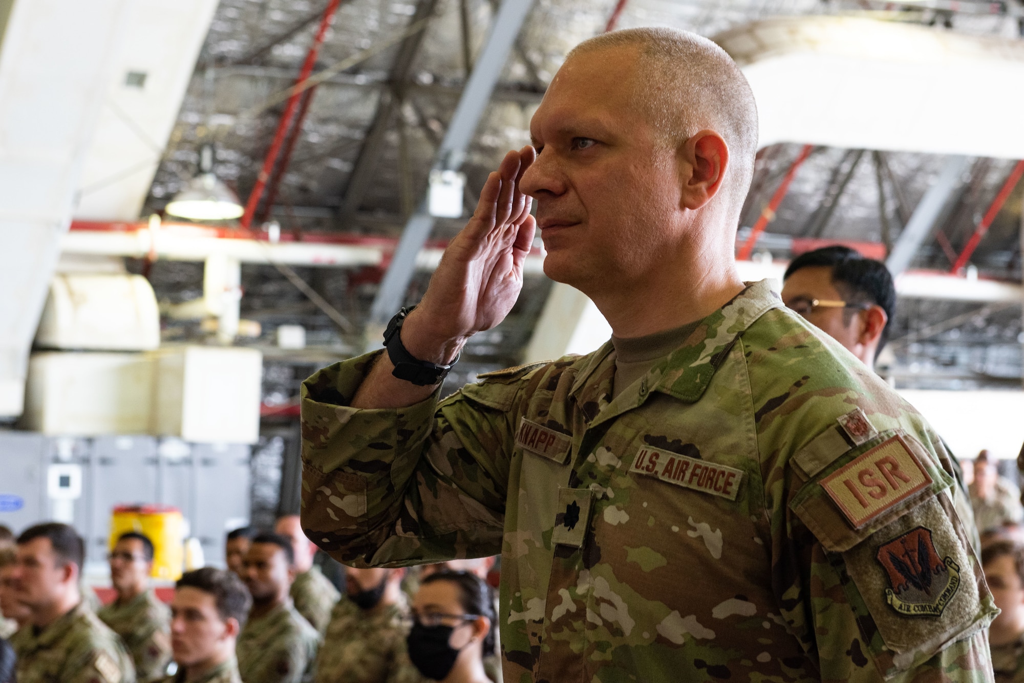 Lt. Col. Jarrod Knapp, 694th Intelligence, Surveillance and Reconnaissance Group deputy commander, gives the outgoing commander his final salute during a change of command at Osan Air Base, Republic of Korea, 8 July, 2022.