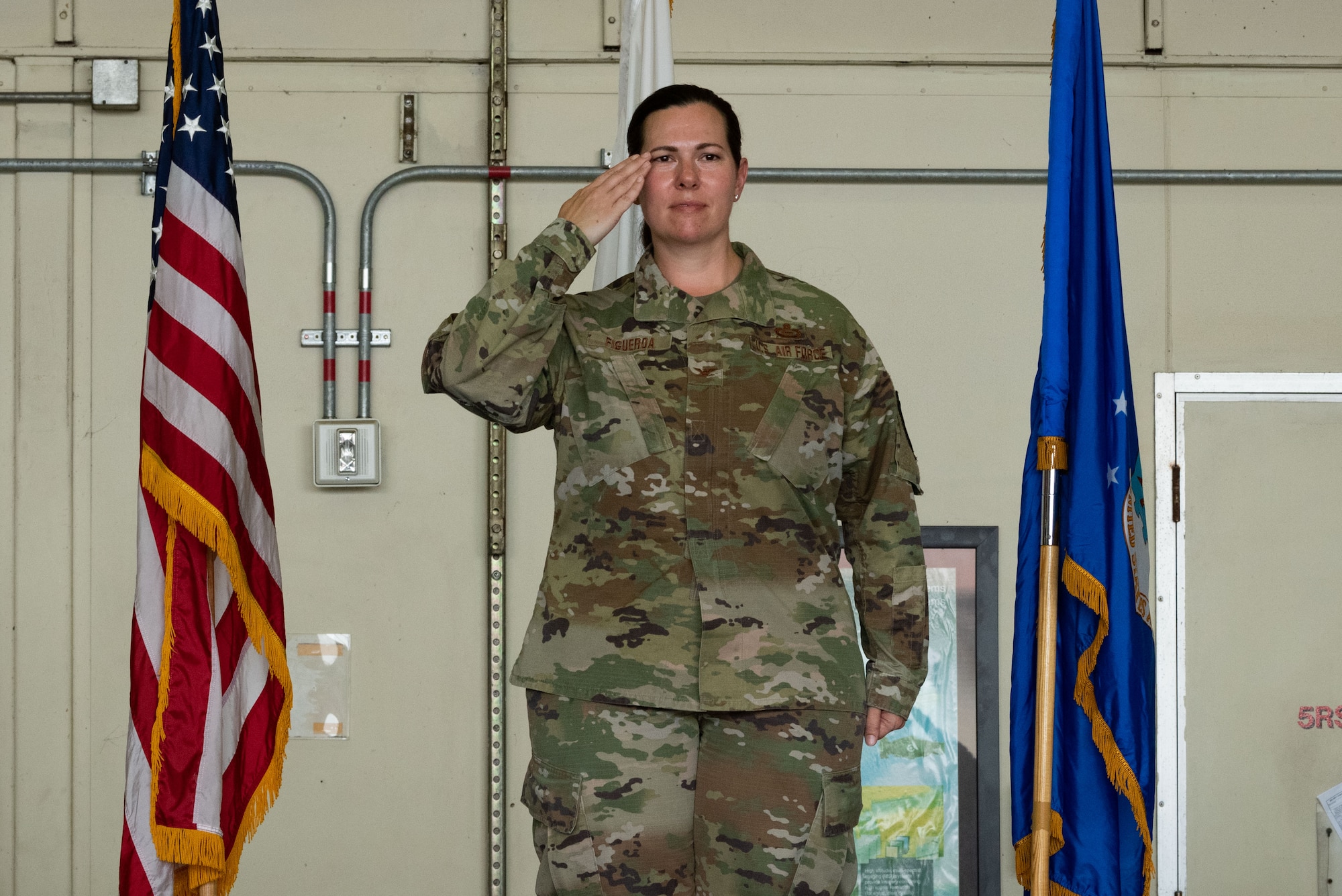 Col. Amanda Figueroa, 694th Intelligence, Surveillance and Reconnaissance Group incoming commander, delivers her first salute as commander during a change of command at Osan Air Base, Republic of Korea, 8 July, 2022.