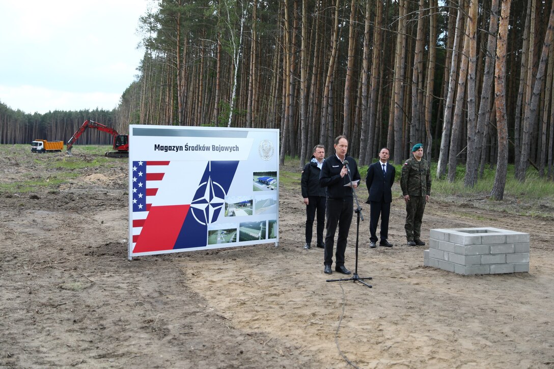 U.S. Ambassador to Poland Mark Brzezinski gives remarks at a groundbreaking ceremony for a Munitions Storage Area being constructed in Powidz, Poland June 2, 2022, where he was joined by Polish Minister of National Defense Mariusz Błaszczak, NATO Investment Committee Chair Emanuele Meli and Plenipotentiary to the Minister of Defense for the Enhanced Defense Cooperation Agreement Polish Brig. Gen. Dariusz Mendrala. The ceremony marked the beginning of the Poland Provided Infrastructure program, which provides a mechanism for sharing the costs for U.S. forces in Poland. Infrastructure projects are funded by Poland and are designed and constructed to meet U.S. requirements for use by U.S. forces operating in Poland. For its part, the U.S. will continue to bear the costs of training, equipping, deploying and employment of U.S. forces in the country. (U.S. Army photo by Staff Sgt. Angel D. Martinez-Navedo)