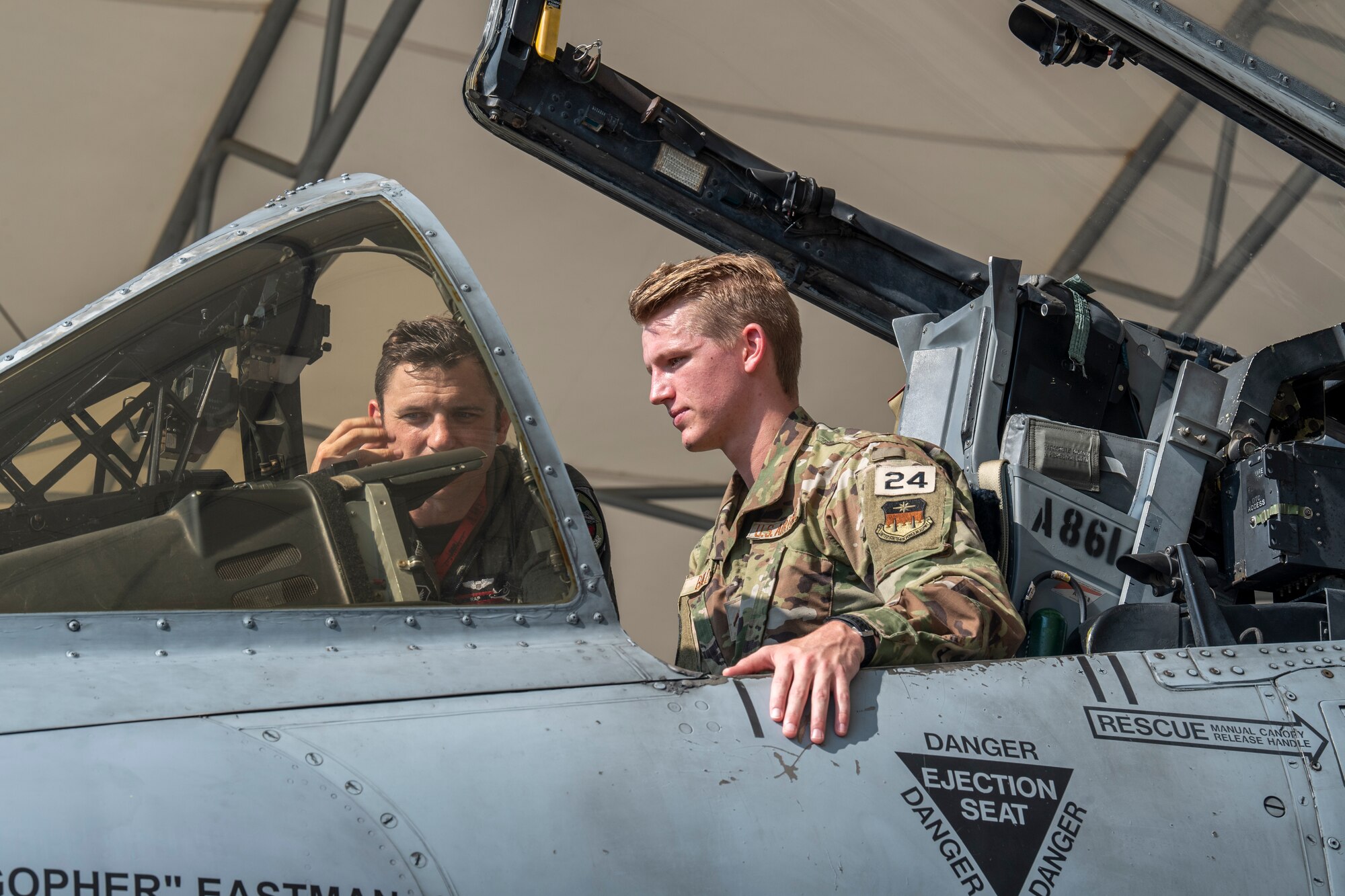 U.S. Air Force Capt. Brandon Bylina, 75th Fighter Squadron A-10C Thunderbolt II pilot, shows U.S Air Force Academy Cadet 2nd Class Wesley Bailey the inside of an A-10C Thunderbolt II aircraft at Moody Air Force Base, Georgia, June 24, 2022.