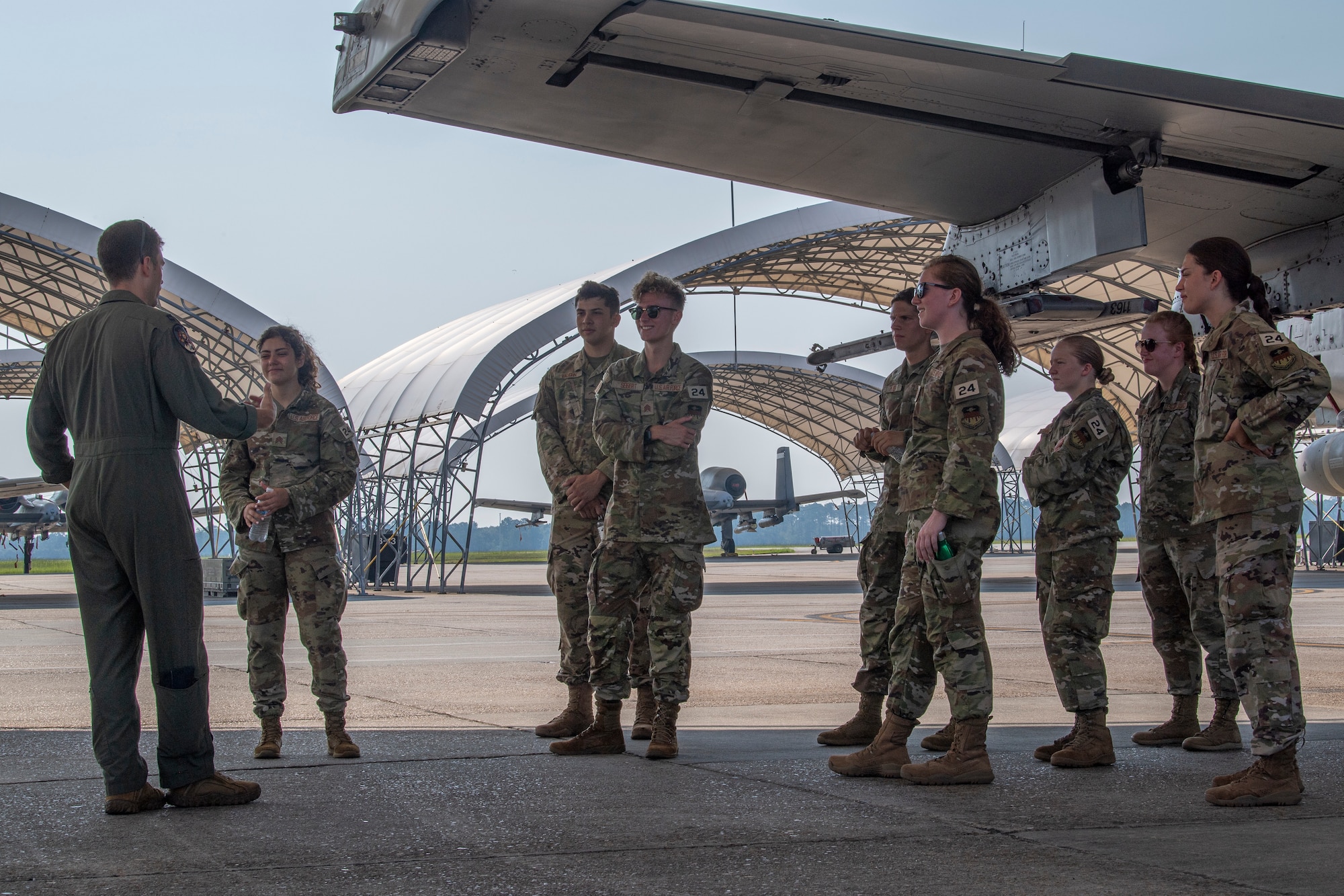 U.S. Air Force Capt. Riley Nix, 74th Fighter Squadron A-10C Thunderbolt II pilot, left, speaks with U.S. Air Force Academy cadets at Moody Air Force Base, Georgia, June 24, 2022.