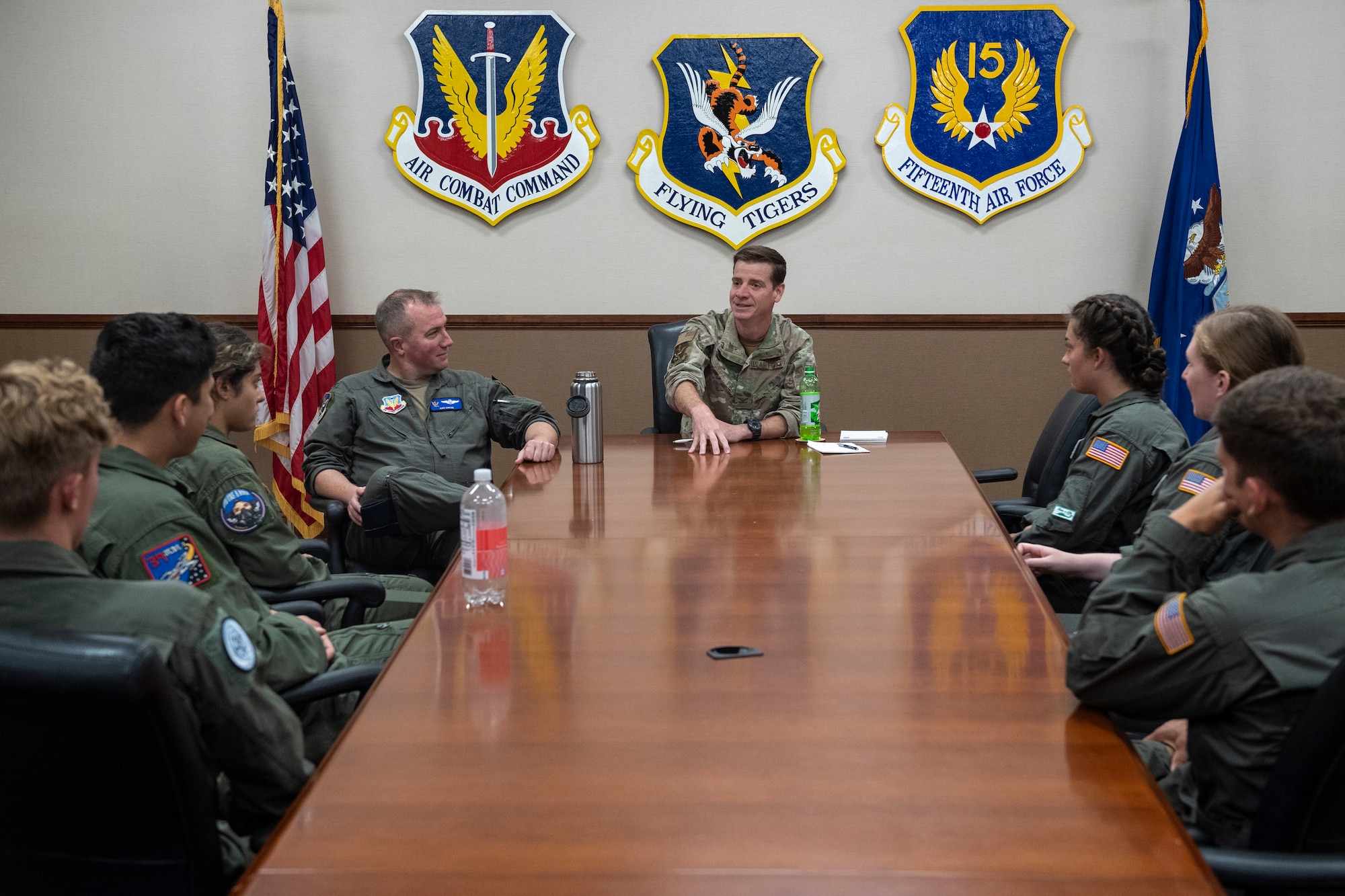 U.S. Air Force Col. Russ Cook, 23rd Wing commander, center, speaks to U.S. Air Force Academy cadets with Col. Ryan Hayde, 23rd Wing vice commander, back left, at Moody Air Force Base, Georgia, July 6, 2022. USAFA cadets came to Moody AFB for Operation Air Force, a required summer program that gives cadets the opportunity to see an operational Air Force base.