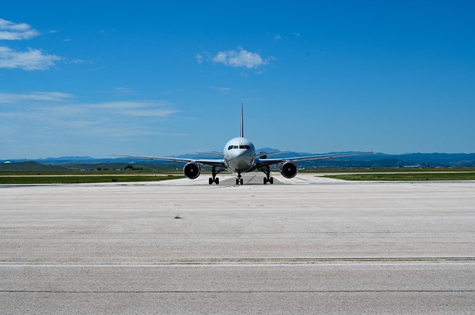 A Boeing 767 lands at Ellsworth Air Force Base, South Dakota, carrying 150 Airmen returning from a Bomber Task Force Mission, July 4.