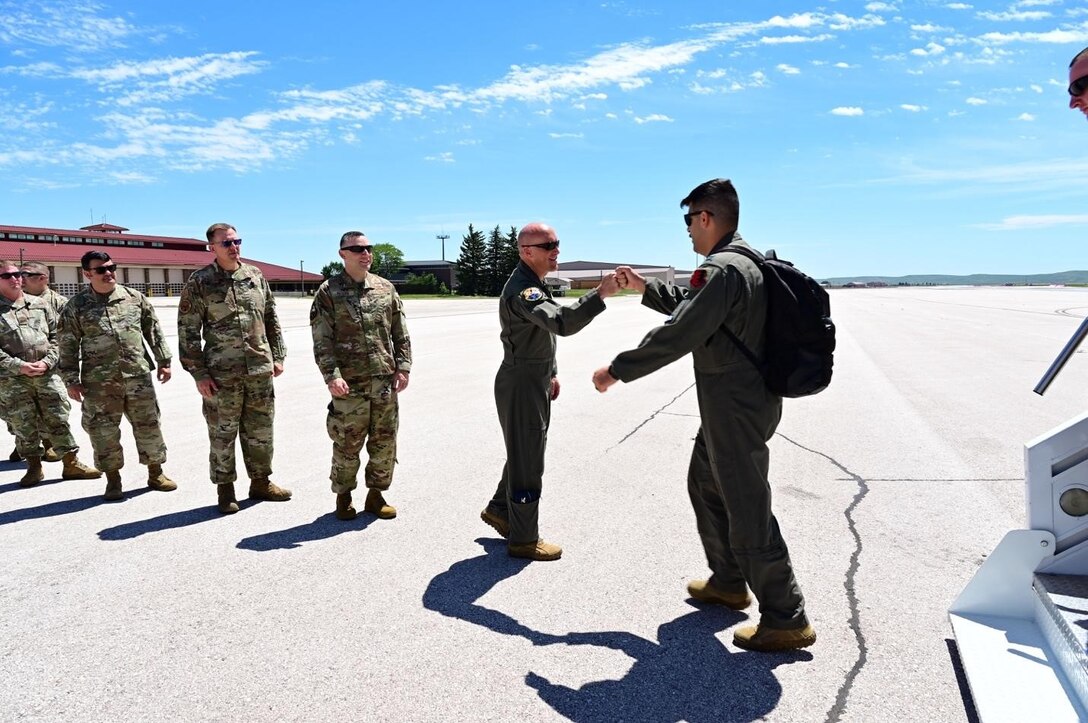 U.S. Air Force Col. Derek Oakley, Operations Group Commander at 28th Bomb Wing, greets Airmen returning to Ellsworth Air Force Base, South Dakota, from a Bomber Task Force Mission, July 4.