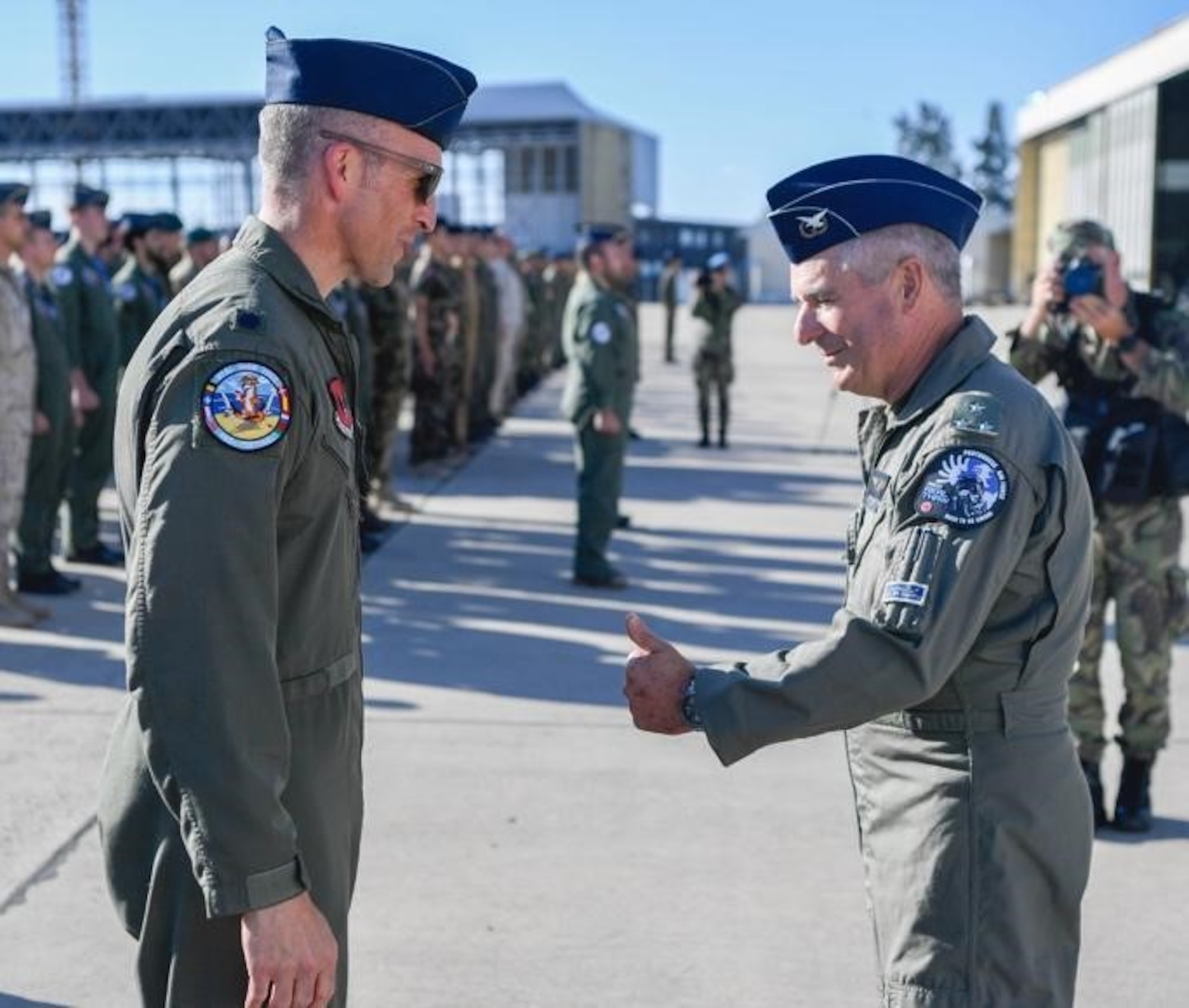 U.S. Air Force Lt. Col. Shaun Loomis, 480th Fighter Squadron commander, (left), is greeted by Lt. Gen. António Jose de Matos Branco, Air Commander of the Portuguese air force, during the opening ceremony at Exercise Real Thaw 22 on Beja Air Base, Portugal, June 26, 2022. Partnerships created through recurring exercises like Real Thaw, support the ability to employ a strategic force in theater. (U.S. Air Force photo by Tech. Sgt. Warren D. Spearman Jr.)