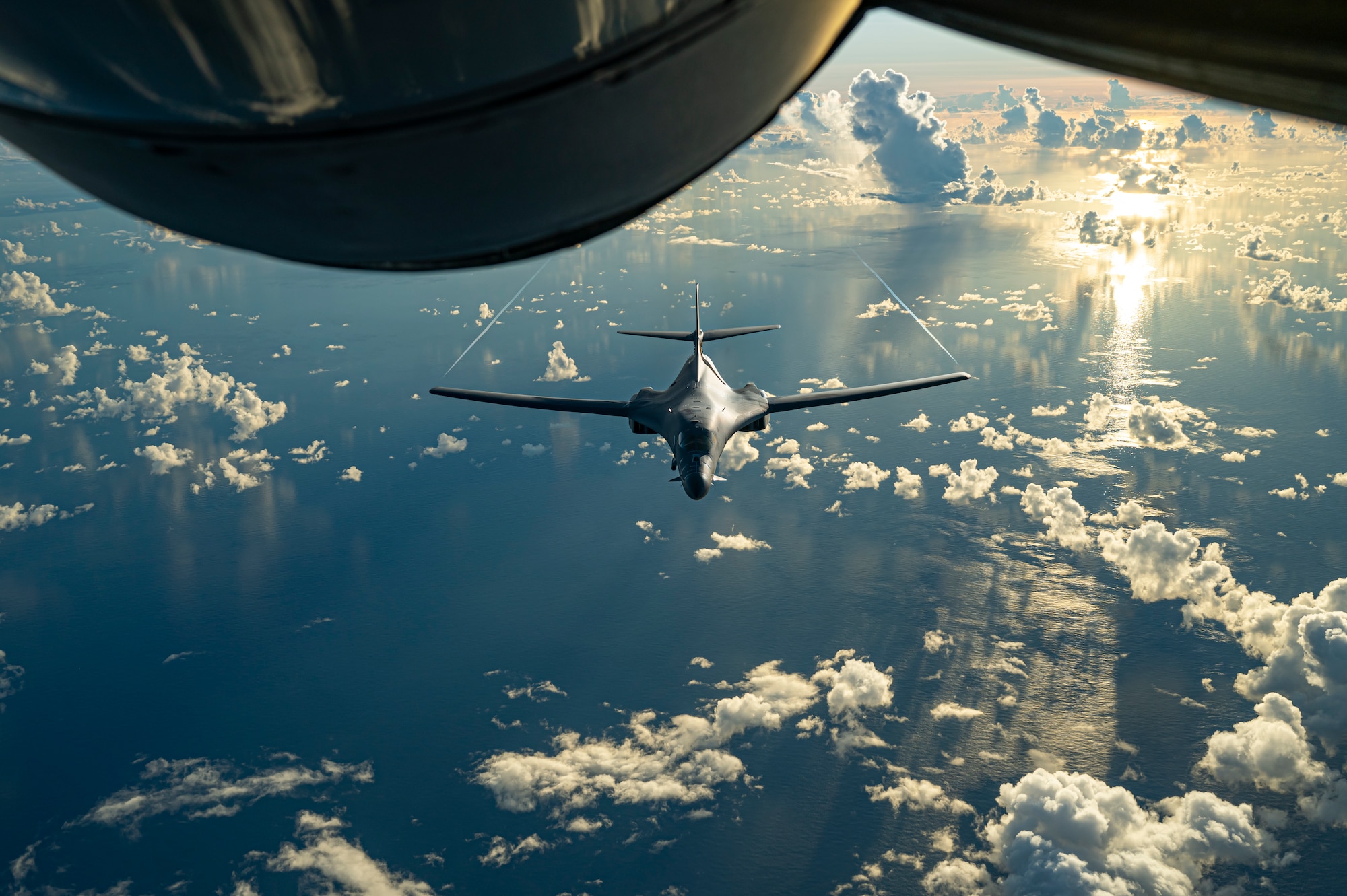 A B-1B Lancer, assigned to 34th Expeditionary Bomb Squadron, positions behind a KC-135 Stratotanker, assigned to 506th Expeditionary Air Refueling Squadron, during a Bomber Task Force mission over the Pacific Ocean, June 20, 2022.