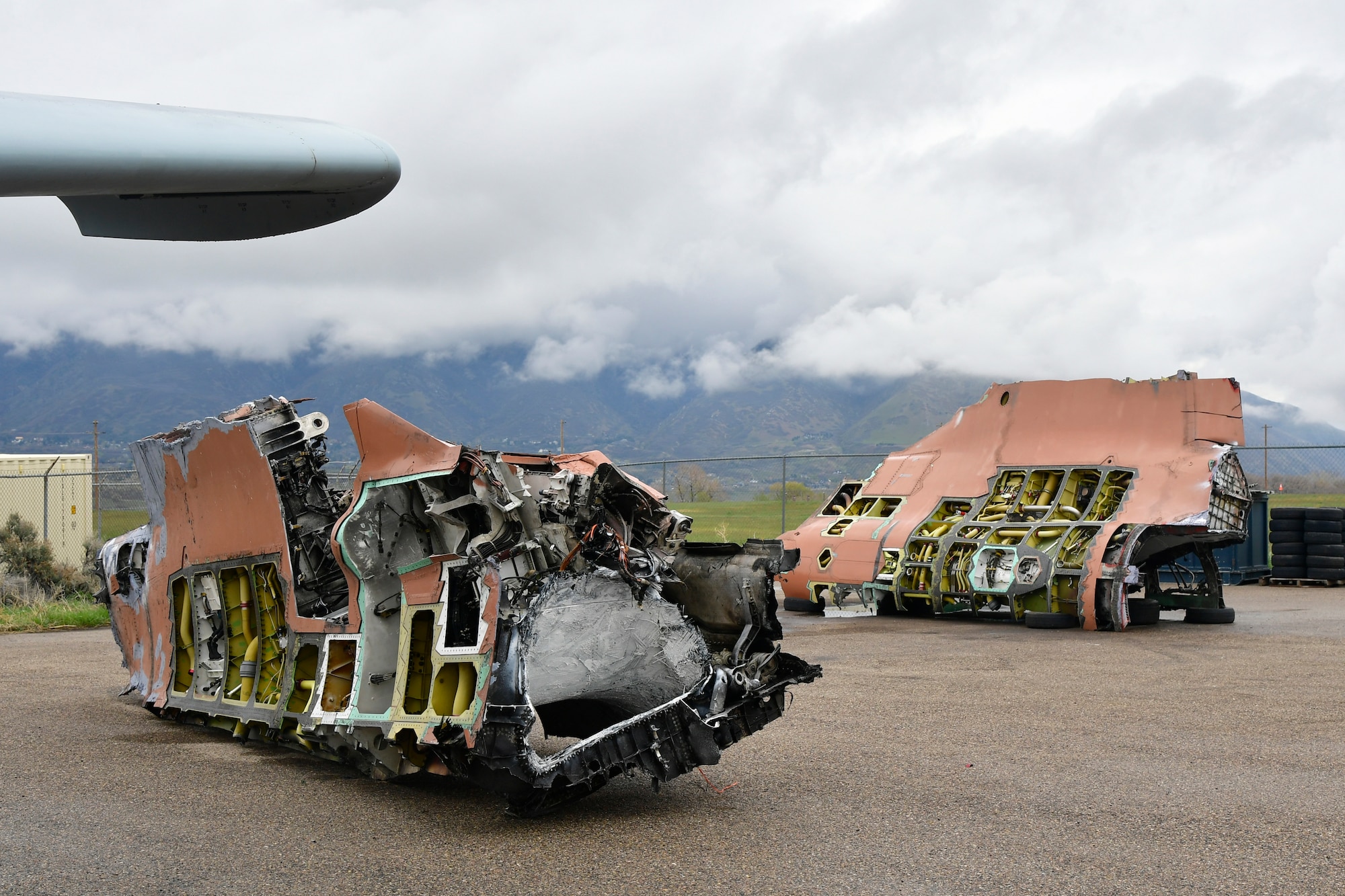 A salvaged F-35A fuselage sits in two sections after being cut in half with the volunteer help of a civilian saw manufacturing company May 4, 2022, Hill Air Force Base, Utah. The aircraft was condemned after an accident and is currently being transformed into sectional training aids by the 372nd Training Squadron, Det. 3, for use during instruction of F-35 maintainers. (U.S. Air Force photo by Todd Cromar)