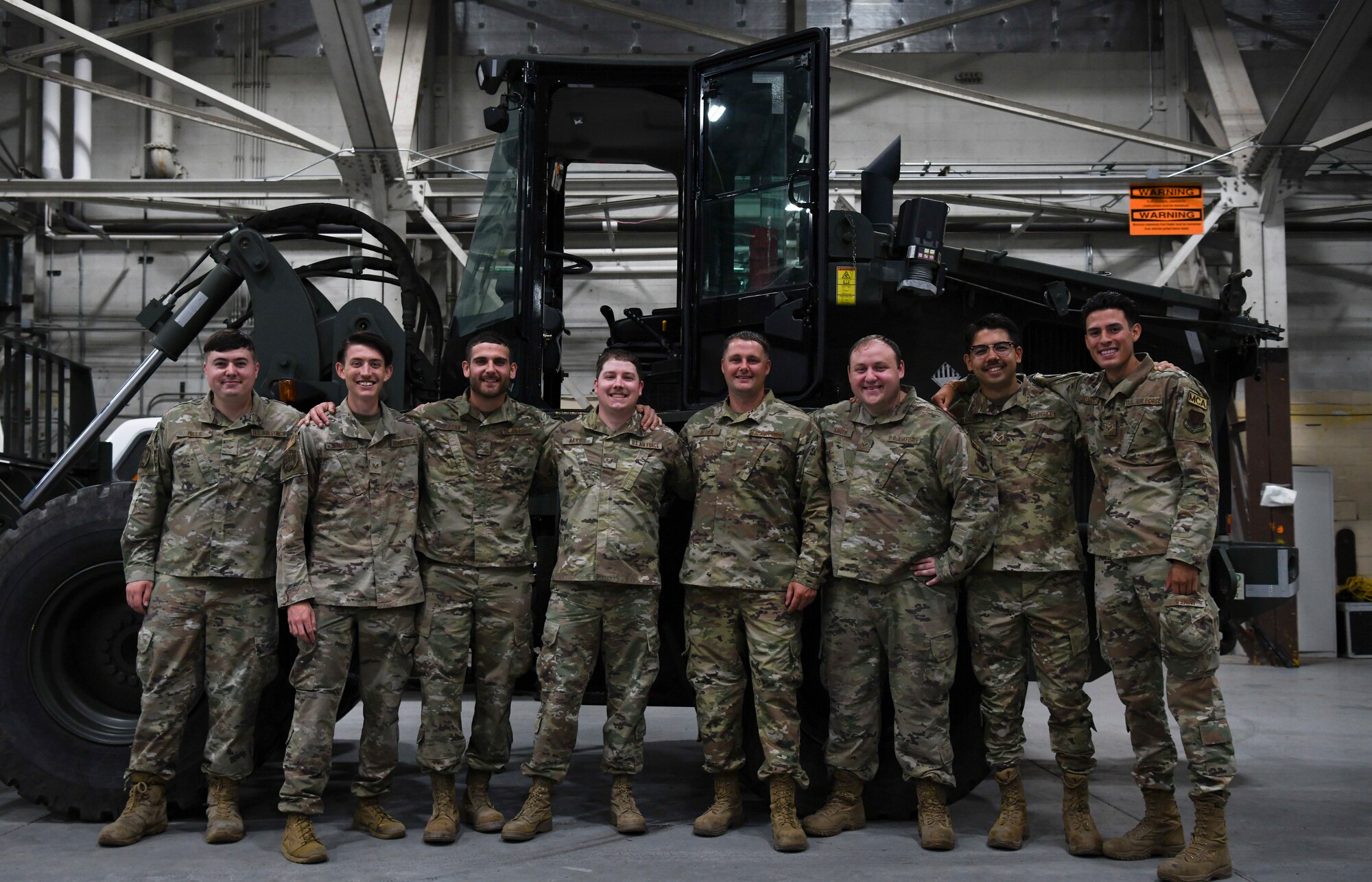 A group of airmen pose for a photo.