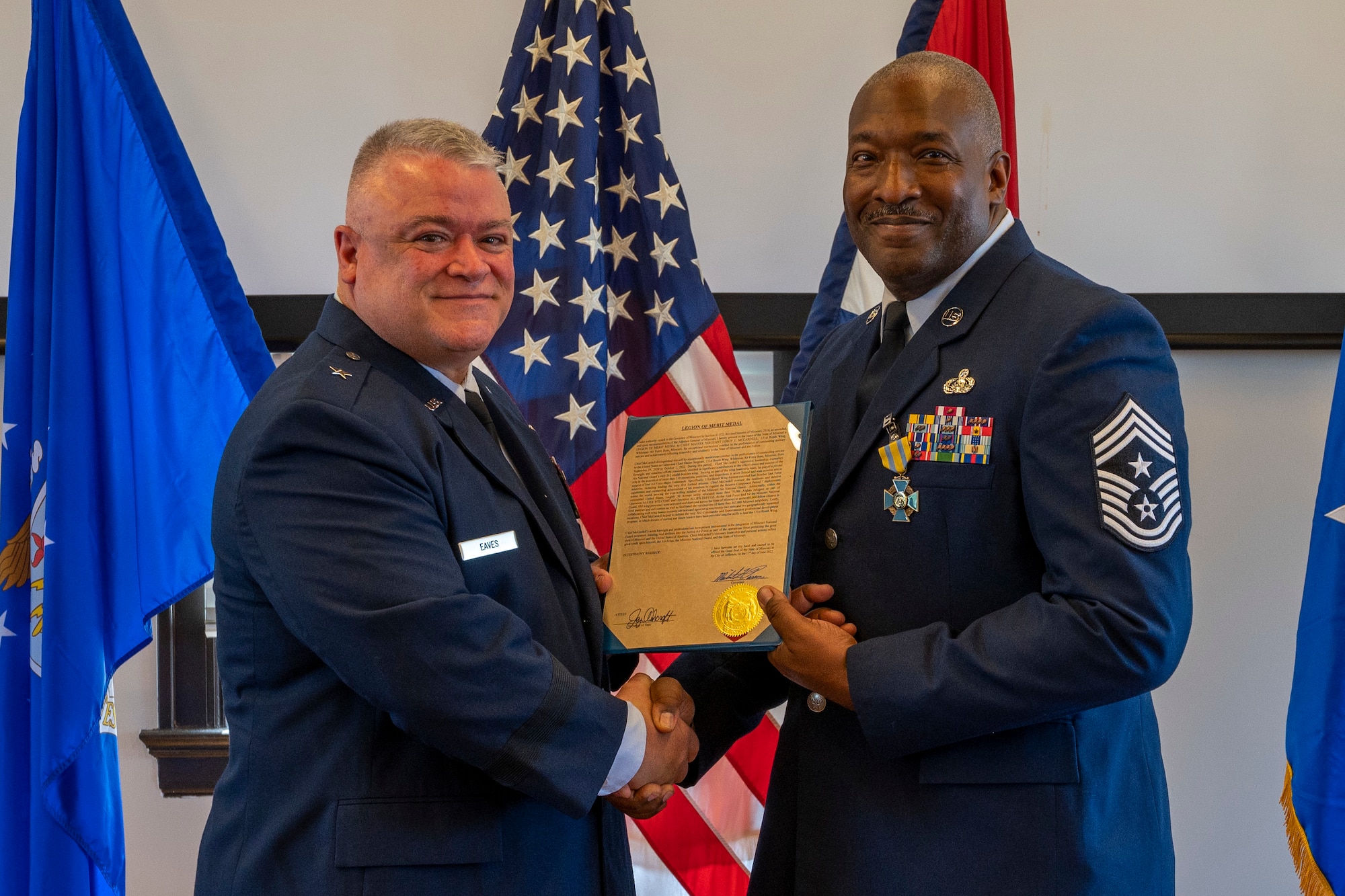Chief Master Sgt. LeRoy E. McCardell Jr., right, 131st Bomb Wing command chief master sergeant, stands with Brig. Gen. Kenneth S. Eaves, Assistant Adjutant General- Air, Missouri National Guard, during his retirement ceremony, June 25, 2022, at Jefferson Barracks Air National Guard Base, St. Louis, Missouri. McCardell served for 34 years. (U.S. Air National Guard photo by Senior Airman Whitney Erhart)