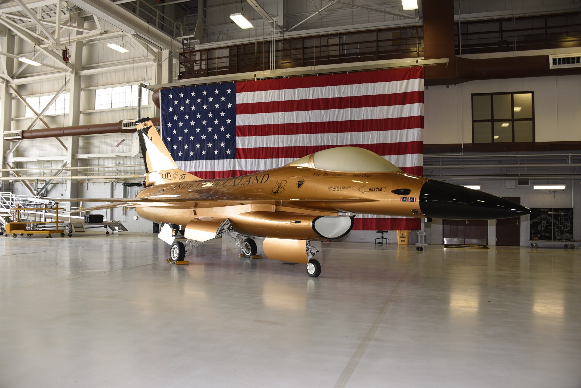 A gold F-16A Fighting Falcon from the Iowa Air National Guard sits on display