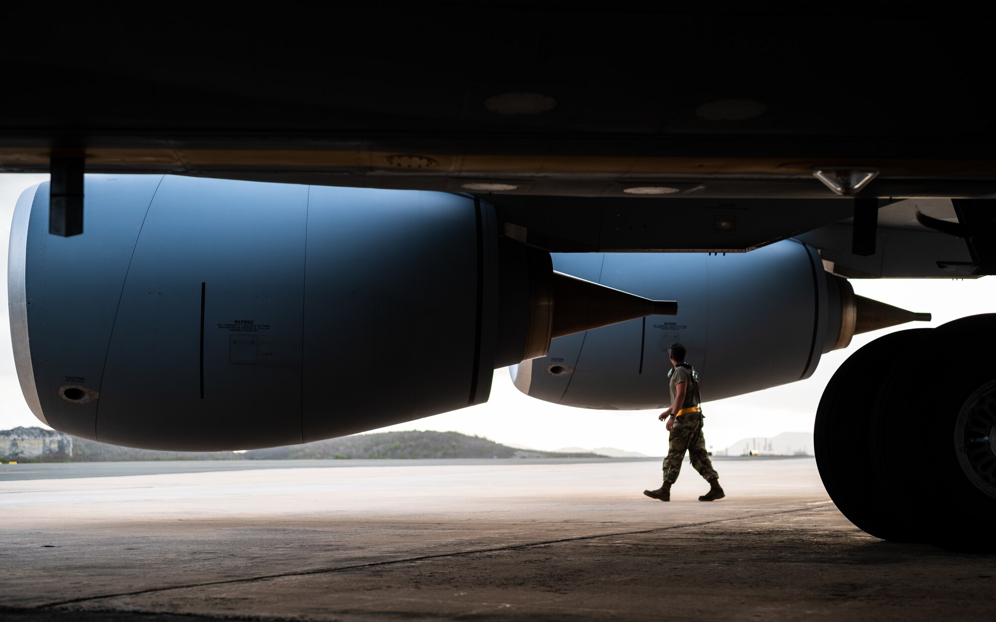 Tech. Sgt. Joseph Perez, 6th Aircraft Maintenance Squadron crew chief, performs pre-flight checks on a KC-135 Stratotanker