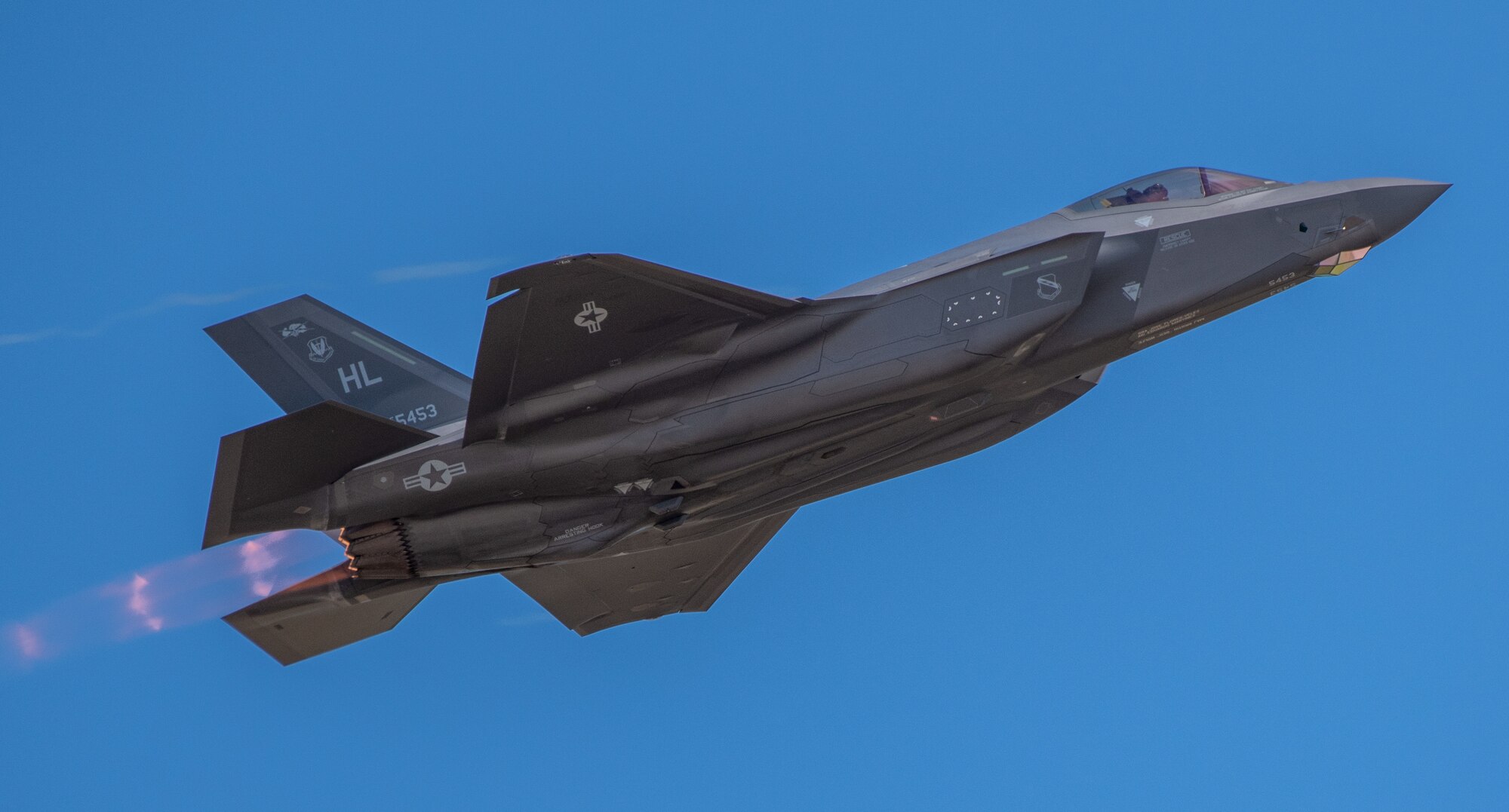 Maj. Kristen Wolfe, F-35A Lightning II Demonstration Team commander with the 388th Fighter Wing, flies over a crowd