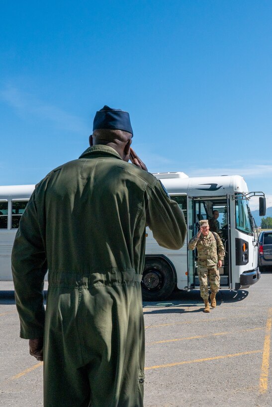 A photo of  Col. Travolis Simmons, the 3rd Wing commander, rendering a salute to U.S. Air Force Lt. Gen. James A. Jacobson, the Pacific Air Forces deputy commander