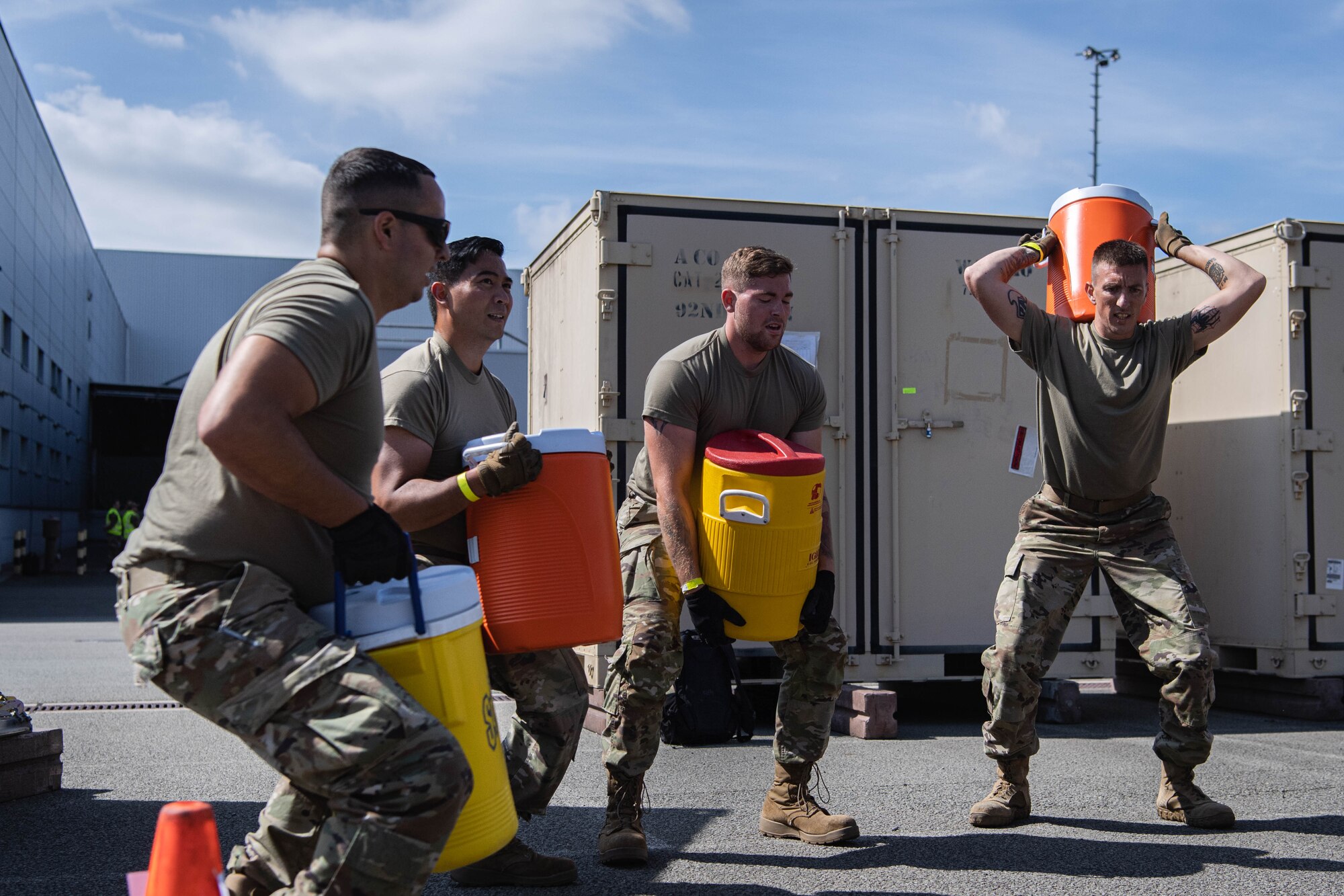Airmen perform squats during an endurance course