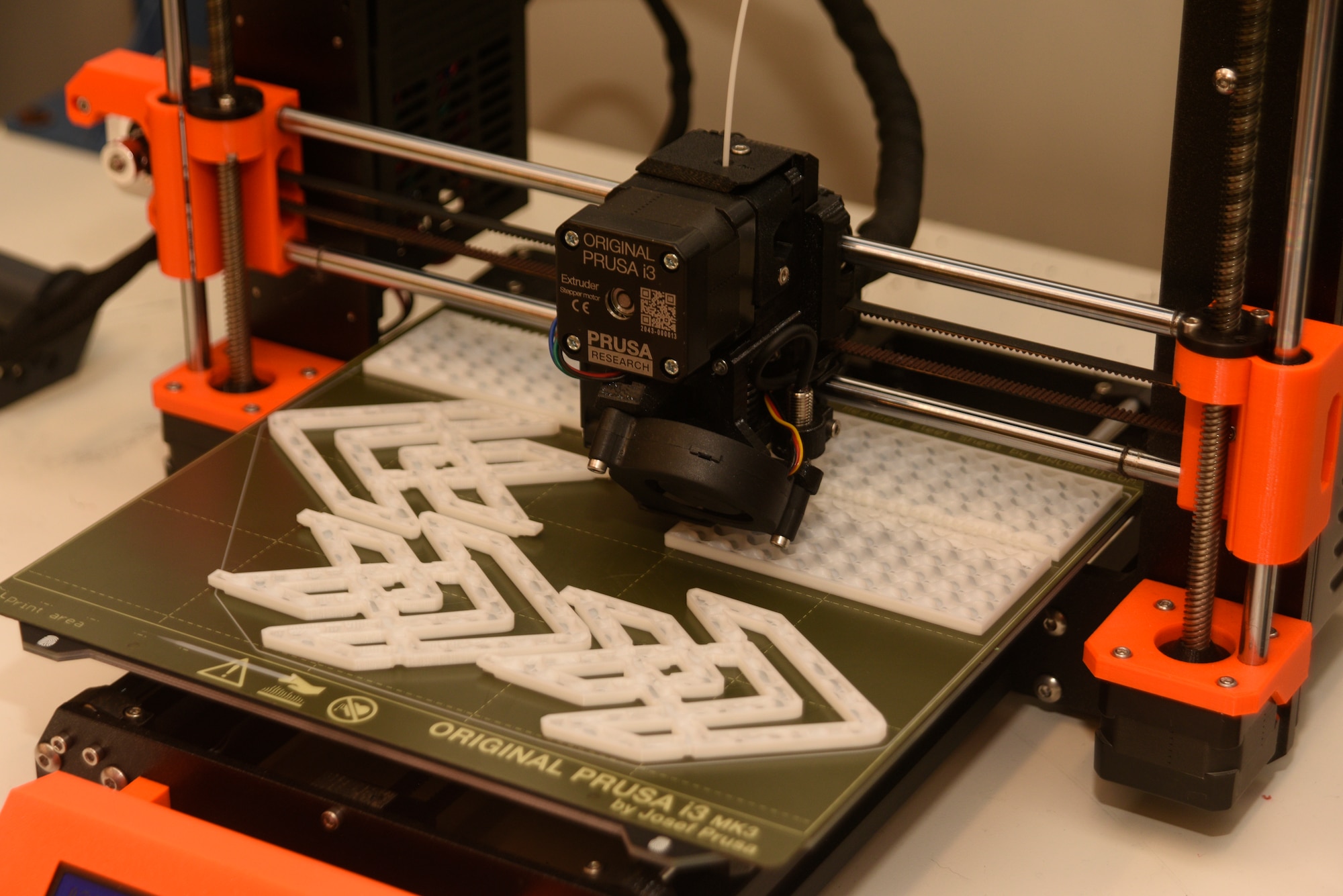 A 3D printer at The Forge, Space Launch Delta 45’s innovation hub at Patrick Space Force Base, Fla., uses a polylactic acid filament to produce decals and other items, June 29, 2022. The Forge has three 3D printers it uses to create a variety of items needed to support the space launch mission. (U.S. Space Force photo by Tech. Sgt. James Hodgman)