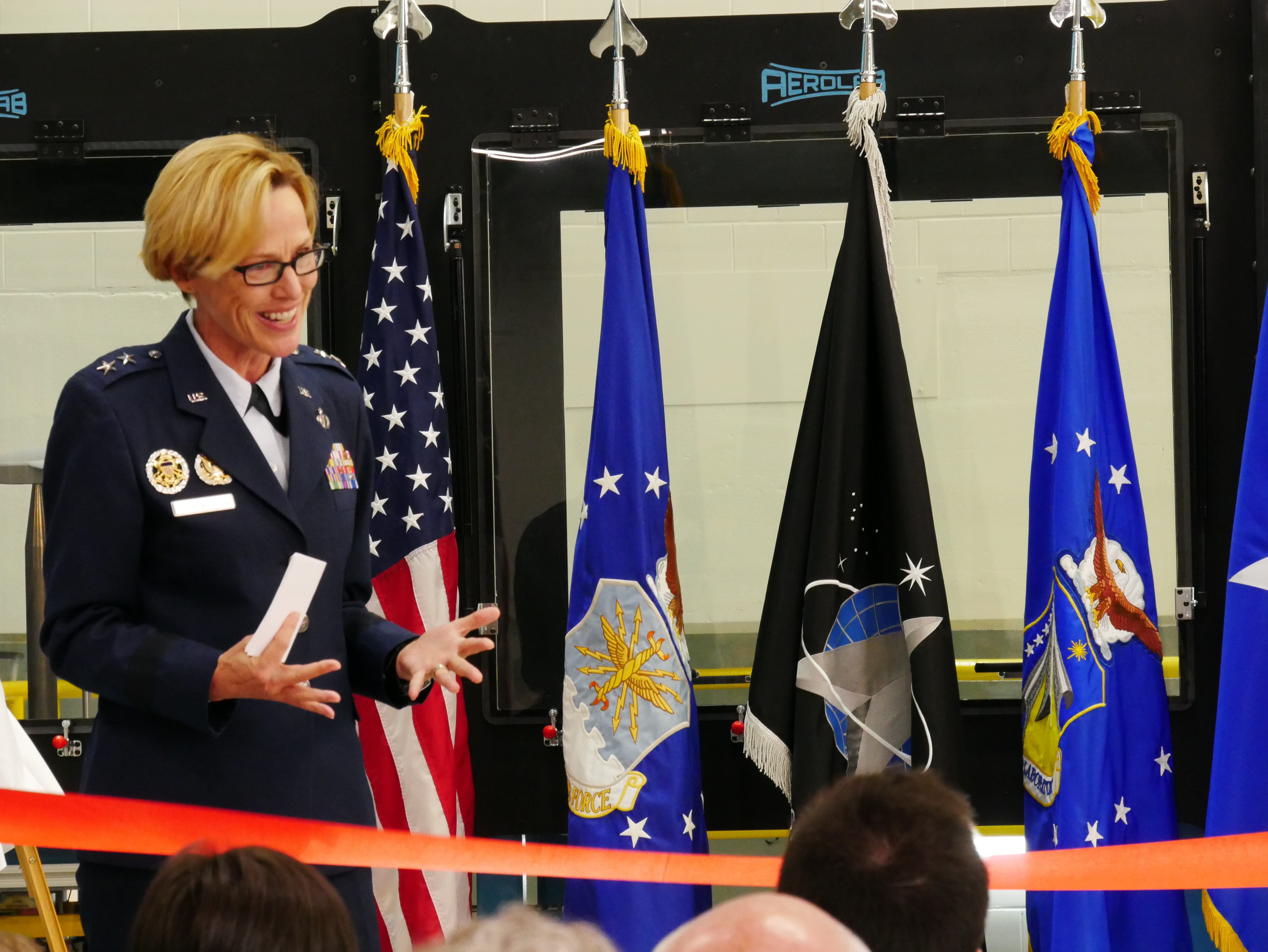 Air Force Research Laboratory Commander Maj. Gen. Heather Pringle speaks prior to a ribbon-cutting and dedication ceremony for the lab’s newest wind tunnel, the Parker Subsonic Research Facility, or SuRF, at Wright-Patterson Air Force Base, Ohio, July 7, 2022. The facility is named after Dr. Greg Parker, a beloved member of AFRL's Aerospace Systems Directorate, who died after a long battle with cancer. SuRF is a low-speed wind tunnel used to evaluate prototype models including 3D-printed components that allows engineers to validate new aircraft designs. Davilyn Parker, wife of Dr. Greg Parker, attended the event in his honor. (U.S. Air Force photo / Kenneth McNulty)
