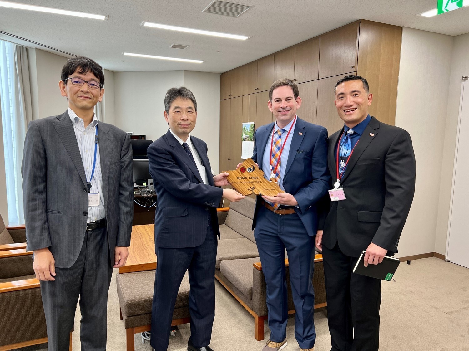 On Jun 10, 2022, Mr. Brian Strahl and Dr. Owen Shieh visited the Japanese Meteorological Agency in Tokyo, Japan, during the 2022 JTWC Roadshow. 

This visit re-established in-person dialogue with JMA and its WMO-designated Typhoon Center, which was not possible throughout the COVID-19 pandemic. Mr. Strahl and Dr. Shieh began by presenting a plaque commemorating the visit and long-standing mutual friendship between the two agencies to the JMA Director General for Atmosphere and Ocean, Mr. Takashi Mori, and the Head of the Regional Specialized Meteorological Center (RSMC), Mr. Takuya Hosomi. In addition to discussing the mutual benefit of the close relationship and continuing liaison efforts, the meeting provided an opportunity to thank JMA for providing real-time radar data to the Office of Naval Research. Having access to this radar network across Mainland Japan and throughout the Ryukus will boost CNMOC’s understanding of the environment in this key location. Mr. Strahl and Dr. Shieh participated in a technical exchange with scientists of the Tokyo Typhoon Center, followed by a tour of the JMA operations floor. This visit put front and center the vital role meteorology and oceanography plays in the battlespace awareness of both our nations as strategic focus continues to shift to the INDOPACOM AOR