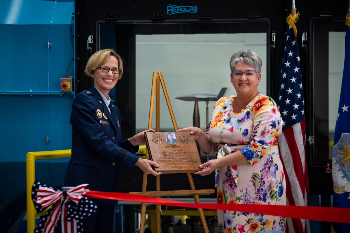 Air Force Research Laboratory Commander Maj. Gen. Heather Pringle and Davilyn Parker, wife of AFRL Aerospace Engineer Dr. Greg Parker, attend a ribbon-cutting and dedication ceremony for the lab’s newest wind tunnel, the Parker Subsonic Research Facility, or SuRF, at Wright-Patterson Air Force Base, Ohio, July 7, 2022. The facility is named after Dr. Greg Parker, a beloved member of AFRL's Aerospace Systems Directorate, who died after a long battle with cancer. SuRF is a low-speed wind tunnel used to evaluate prototype models including 3D-printed components that allows engineers to validate new aircraft designs. (U.S. Air Force photo / Rick Eldridge)