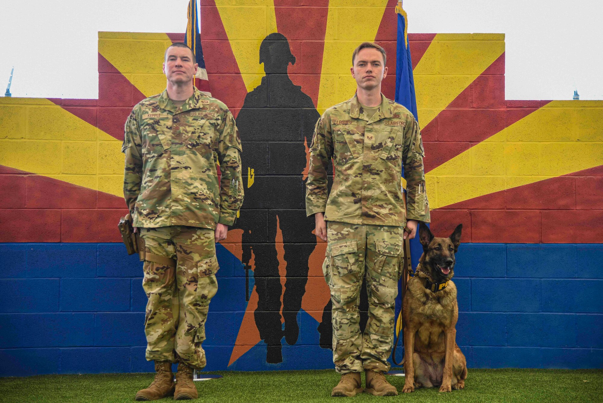 Pictured above are two Airman standing at attention during a ceremony.