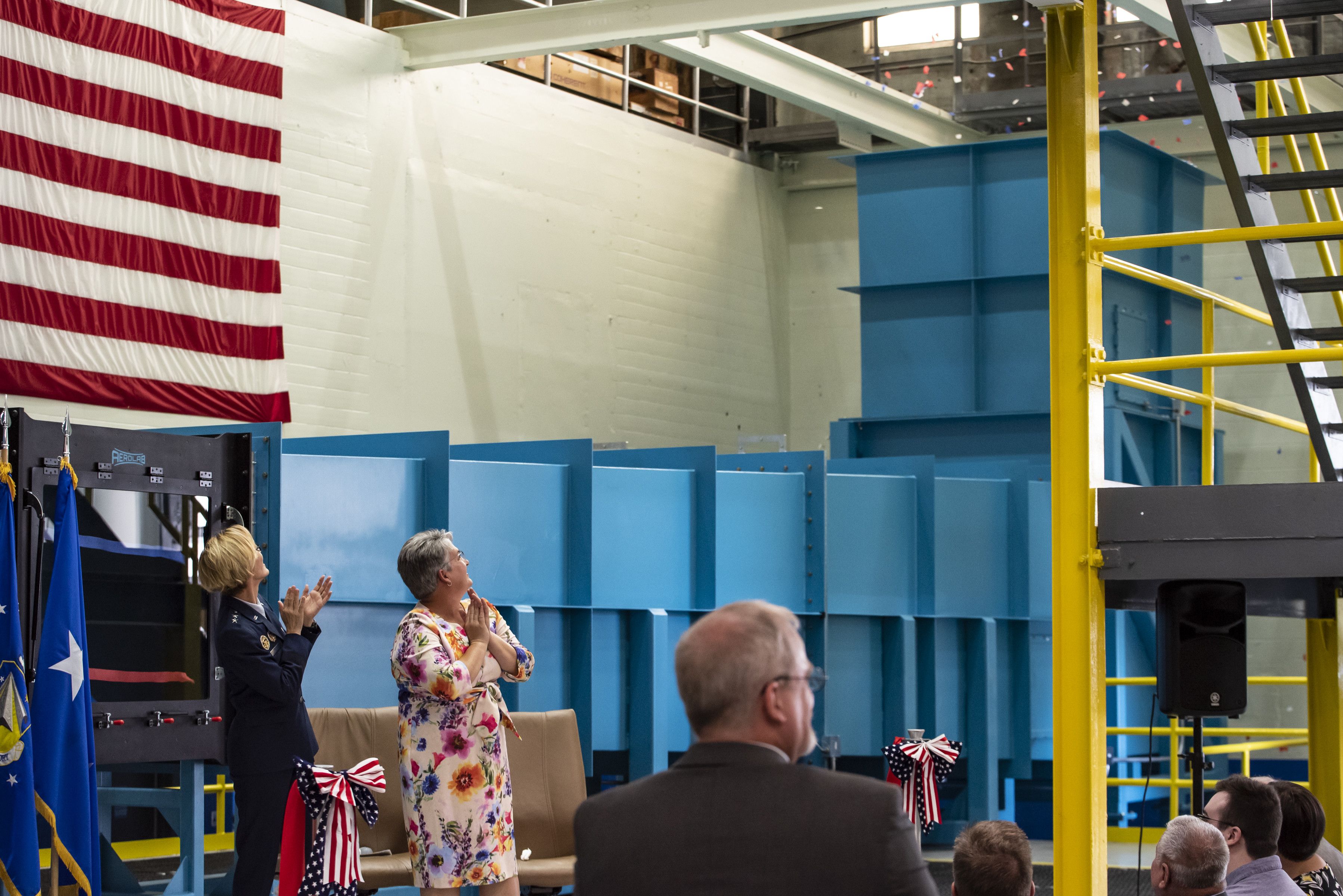 Air Force Research Laboratory Commander Maj. Gen. Heather Pringle and Davilyn Parker, wife of AFRL Aerospace Engineer Dr. Greg Parker, view confetti during a ribbon-cutting and dedication ceremony for the lab’s newest wind tunnel, the Parker Subsonic Research Facility, or SuRF, at Wright-Patterson Air Force Base, Ohio, July 7, 2022. The facility is named after Dr. Greg Parker, a beloved member of AFRL's Aerospace Systems Directorate, who died after a long battle with cancer. SuRF is a low-speed wind tunnel used to evaluate prototype models including 3D-printed components that allows engineers to validate new aircraft designs. (U.S. Air Force photo / Rick Eldridge)