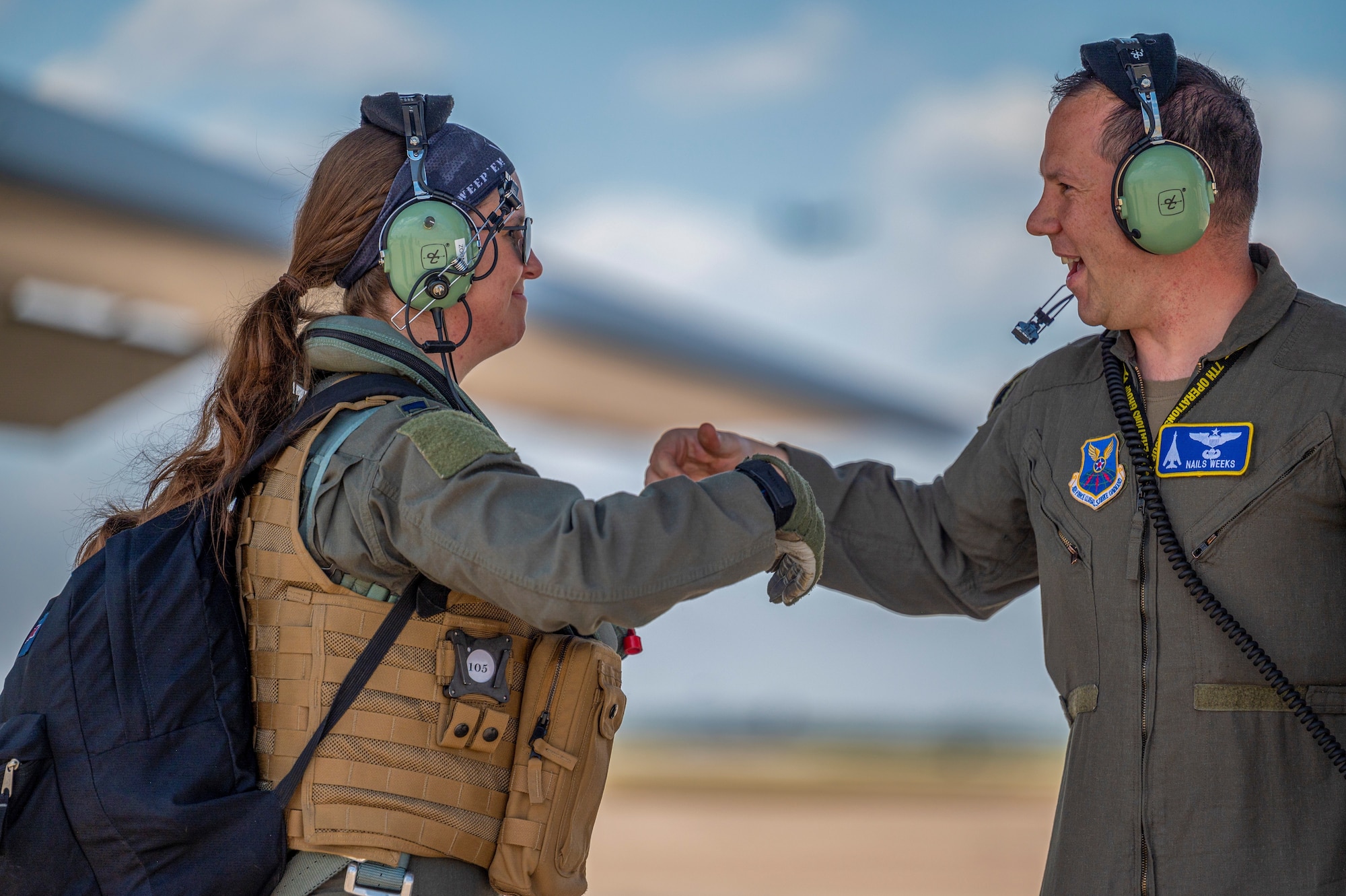 Capt. Erika Tucker, 9th Bomb Squadron pilot, greets Capt. Dustin Weeks, 7th Operations Group executive officer, after conducting pre-flight checks on a B-1B Lancer at Dyess Air Force Base, Texas, June 30, 2022. The U.S. Department of Defense builds partnerships through focused activities such as senior leader engagements, security force assistance, and cooperation, and multi-national exercises. (U.S. Air Force photo by Senior Airman Colin Hollowell)