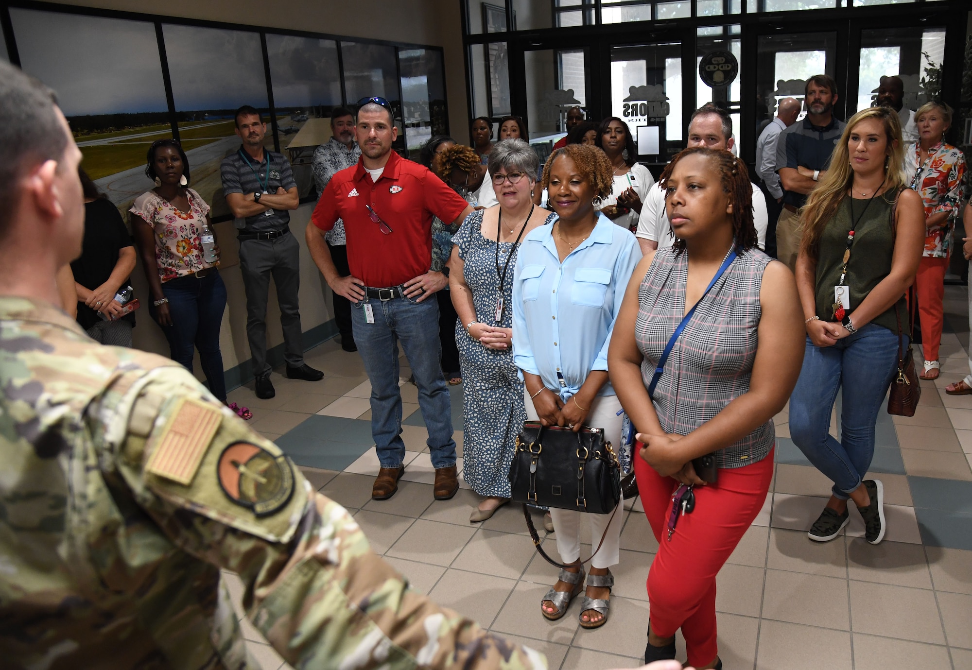 Members of the Biloxi and Jackson County School Districts administration tour the 334th Training Squadron air traffic control course inside Cody Hall at Keesler Air Force Base, Mississippi, July 7, 2022. The visit also included a tour of the student dorms and the weather training course. (U.S. Air Force photo by Kemberly Groue)