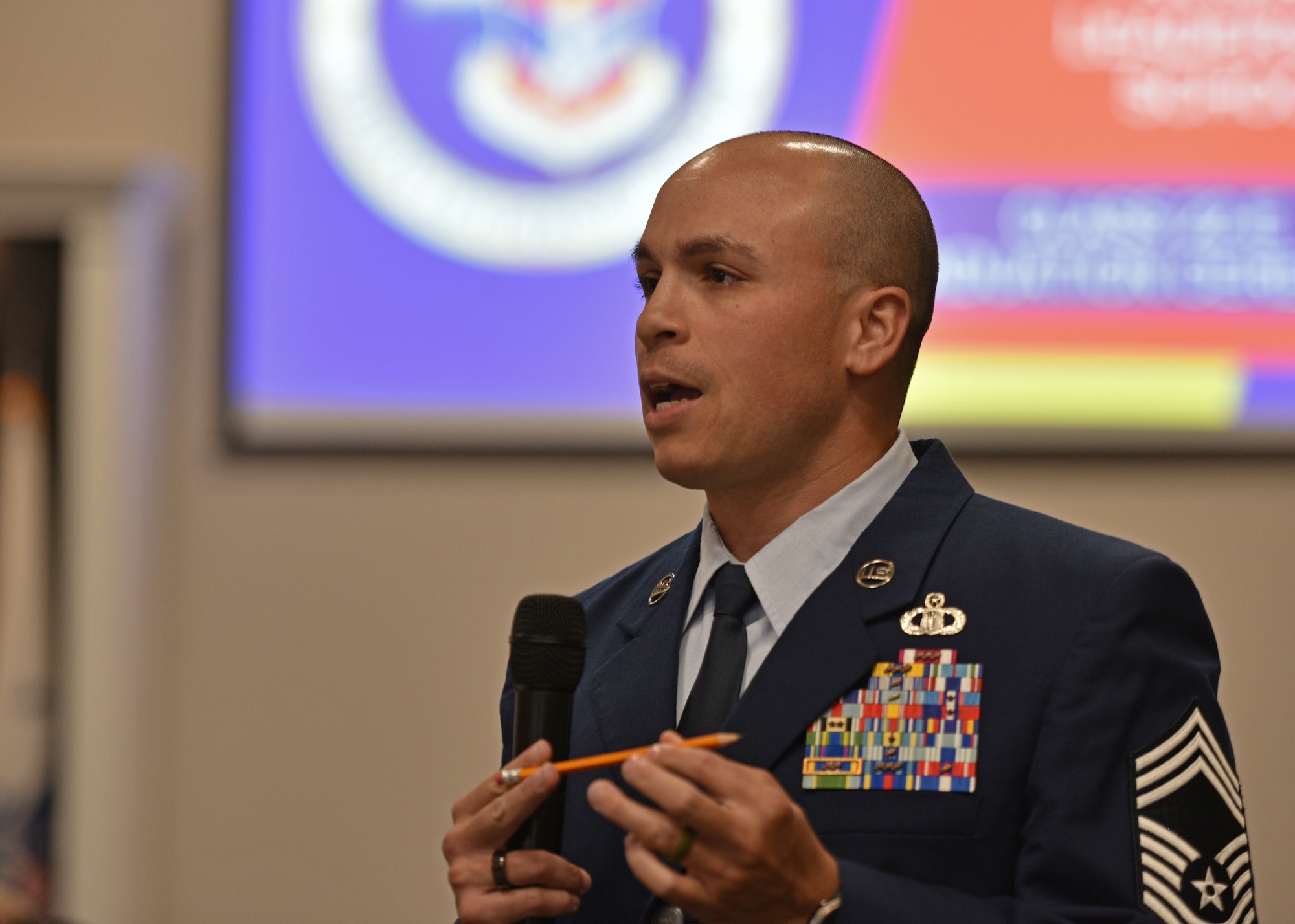 U.S. Air Force Chief Master Sgt. Joshua Matias, 47th Operations Support Squadron senior enlisted leader, speaks during the Airman Leadership School graduation at the Powell Event Center, Goodfellow Air Force Base, Texas, July 7, 2022. Matias offered advice to the new graduates and emphasized taking care of your Airmen and standing up for them as their supervisor. (U.S. Air Force photo by Senior Airman Ashley Thrash)