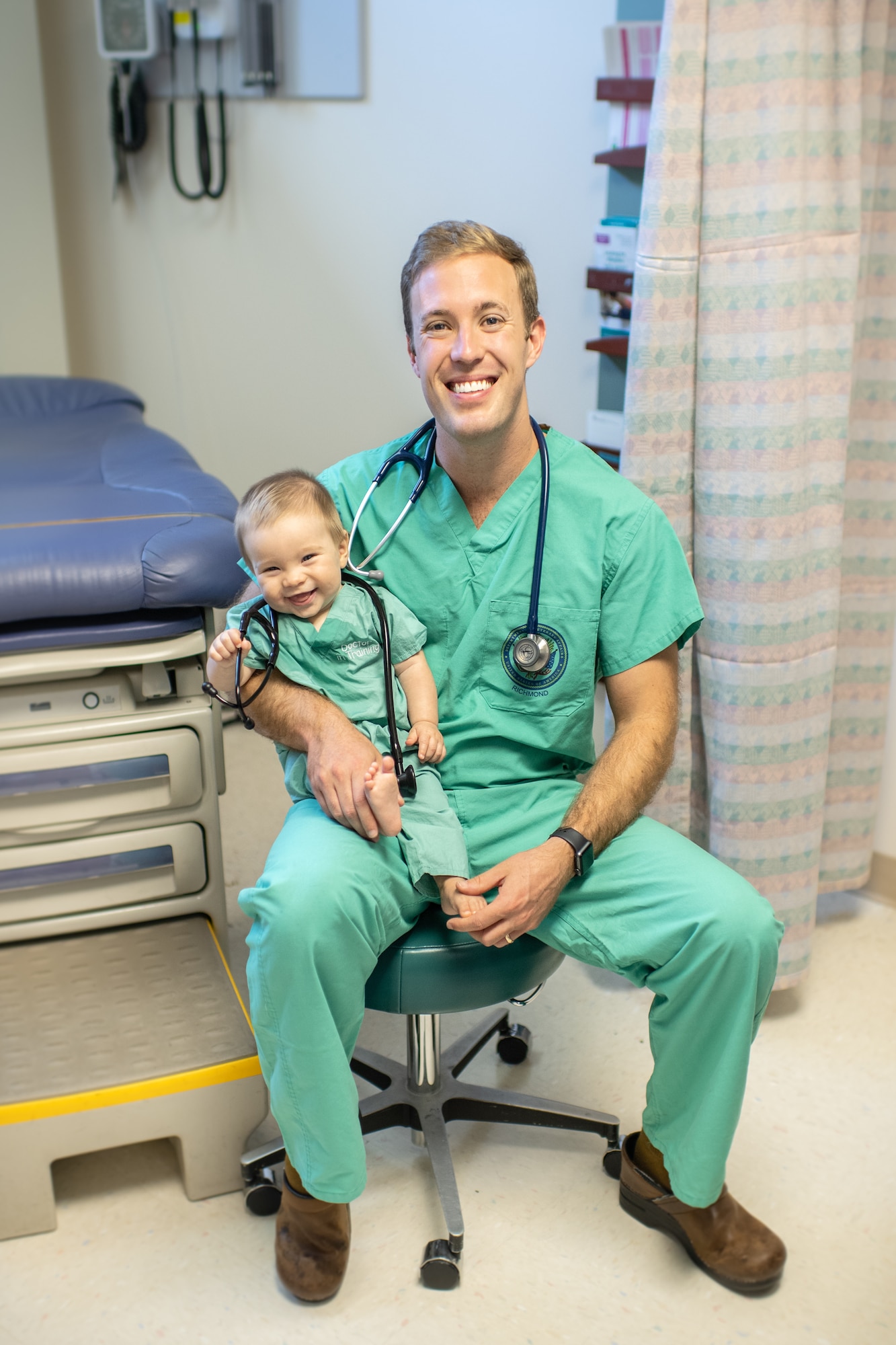 a doctor sitting with a child