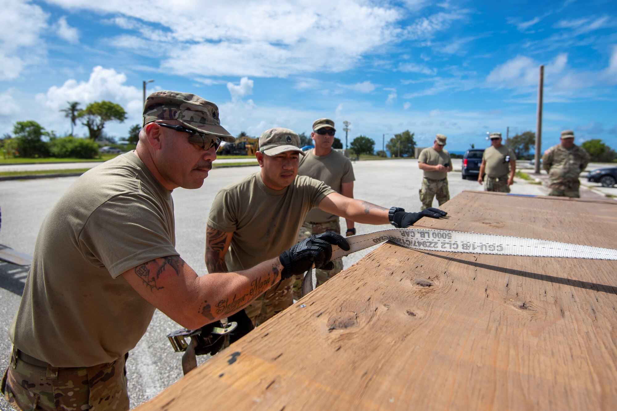 Sgt. Juan Gonzalez and Staff Sgt. Laurence Aglugub, 3302nd Mobilization Support Battalion, 9th Mission Support Command, Fort Shafter Flats, HI. secure cargo onto a pallet during Valiant Shield 2022, June 8, 2022 at Andersen Air Force Base, Guam.