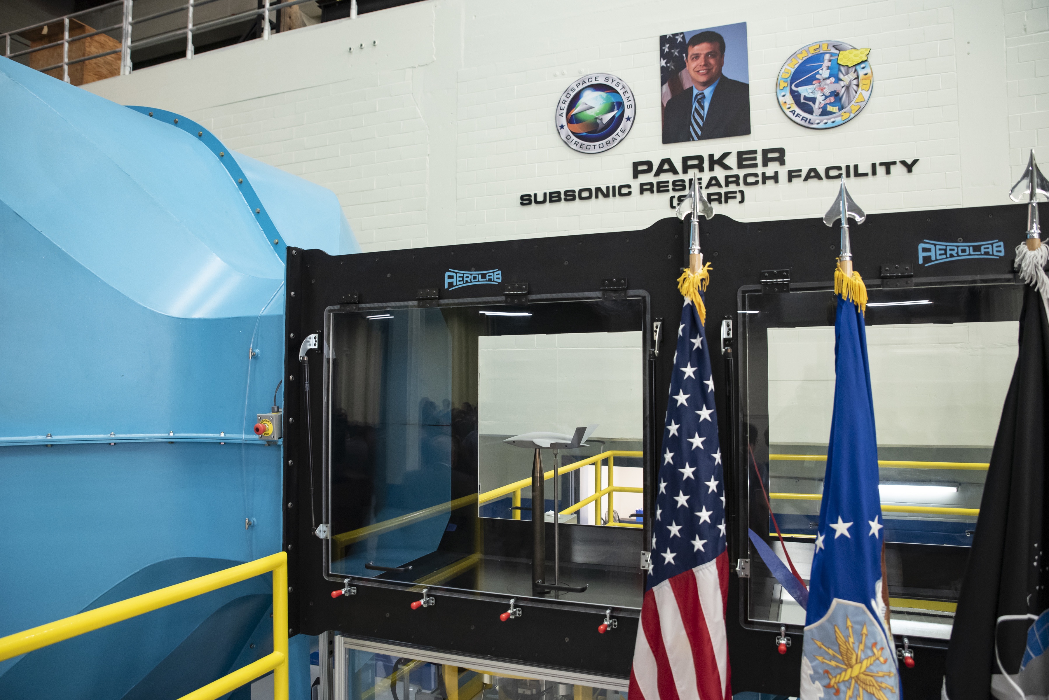 The Air Force Research Laboratory hosted a ribbon-cutting and dedication ceremony for the lab’s newest wind tunnel, the Parker Subsonic Research Facility, or SuRF, at Wright-Patterson Air Force Base, Ohio, July 7, 2022. The facility is named after Dr. Greg Parker, a beloved member of AFRL's Aerospace Systems Directorate, who died after a long battle with cancer. SuRF is a low-speed wind tunnel used to evaluate prototype models including 3D-printed components that allows engineers to validate new aircraft designs. (U.S. Air Force photo / Rick Eldridge)