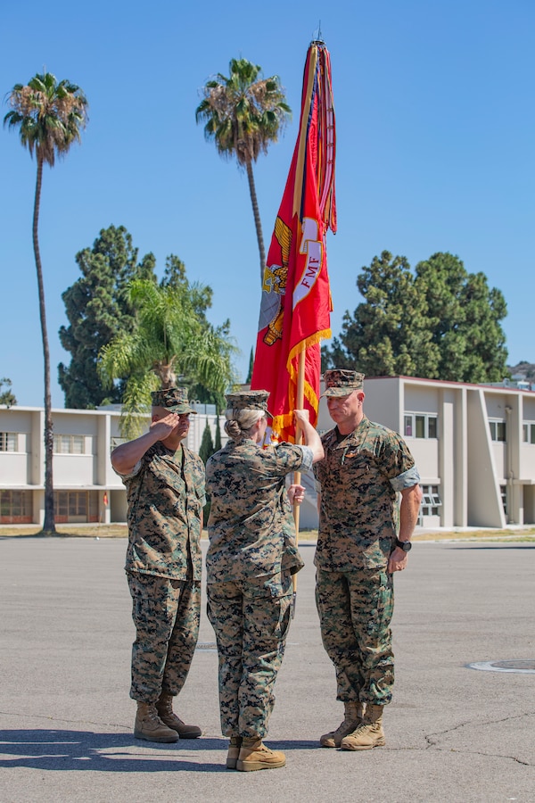 U.S. Marine Corps Col. Siebrand Niewenhous, outgoing commanding officer of 1st Supply Battalion, 1st Marine Logistics Group, I Marine Expeditionary Force, relinquishes command to oncoming commanding officer Col. Taunja Menke during a change of command ceremony on Camp Pendleton California, June 29, 2022. The change of command ceremony marked the passing of command from Col. Siebrand Niewenhous to Col. Taunja Menke. (U.S. Marine Corps photo by Sgt. Thomas Spencer)