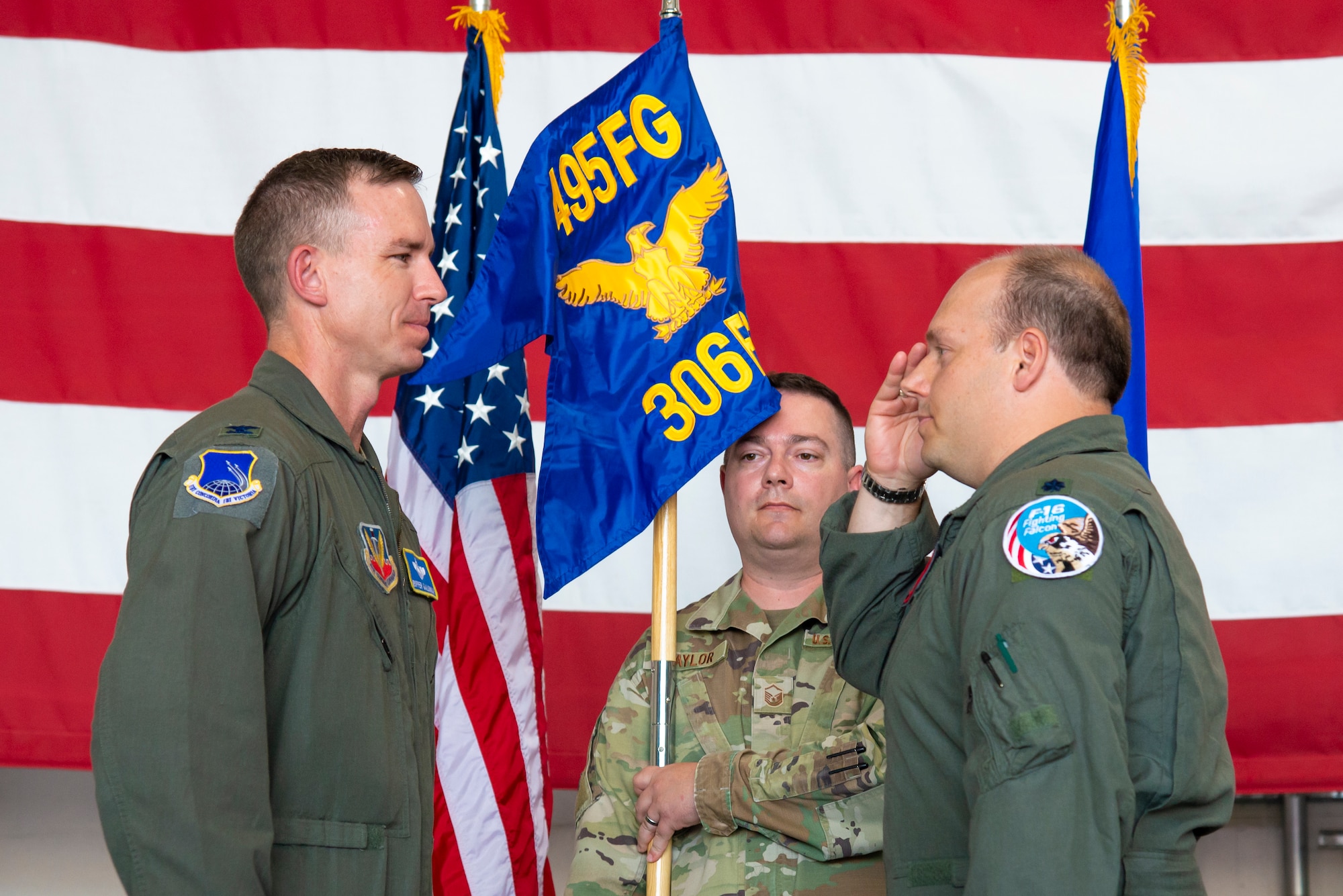 Col. John Galloway receives a salute from Lt. Col. Daniel O'Neal after placing O'Neal in command of the newly activated 306th Fighter Squadron.