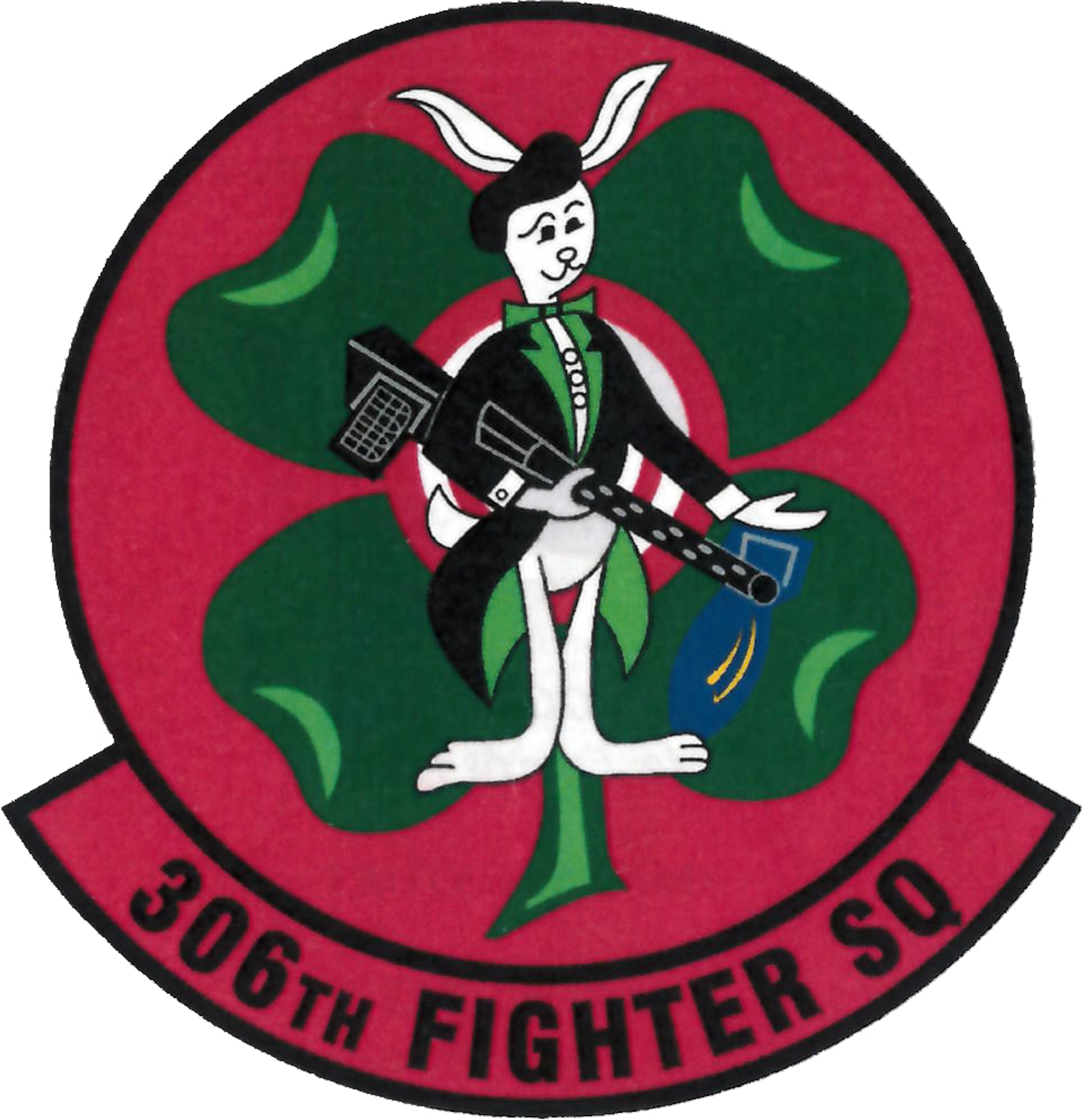 An emblem consisting of a white rabbit, wearing a tuxedo and holding a machine gun, representing the 306th Fighter Squadron