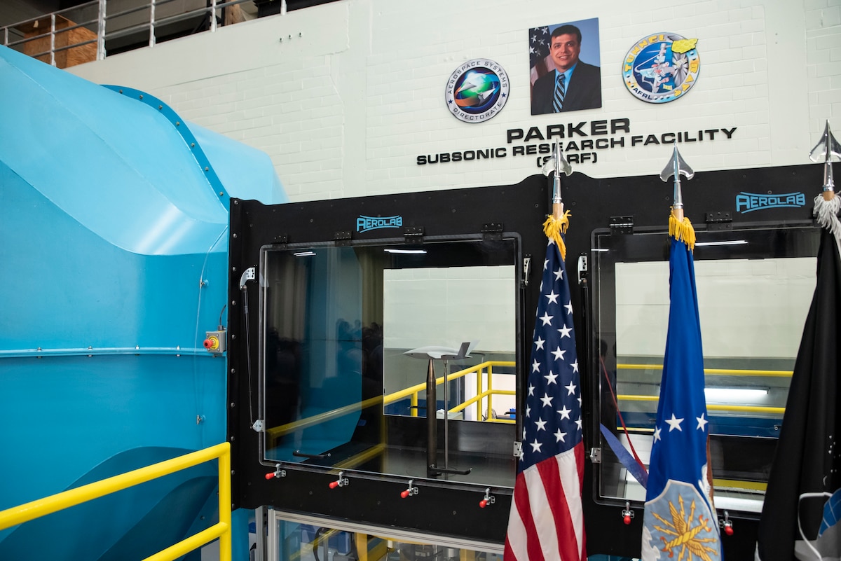 The Air Force Research Laboratory hosted a ribbon-cutting and dedication ceremony for the lab’s newest wind tunnel, the Parker Subsonic Research Facility, or SuRF, at Wright-Patterson Air Force Base, Ohio, July 7, 2022. The facility is named after Dr. Greg Parker, a beloved member of AFRL's Aerospace Systems Directorate, who died after a long battle with cancer. SuRF is a low-speed wind tunnel used to evaluate prototype models including 3D-printed components that allows engineers to validate new aircraft designs. (U.S. Air Force photo / Rick Eldridge)
