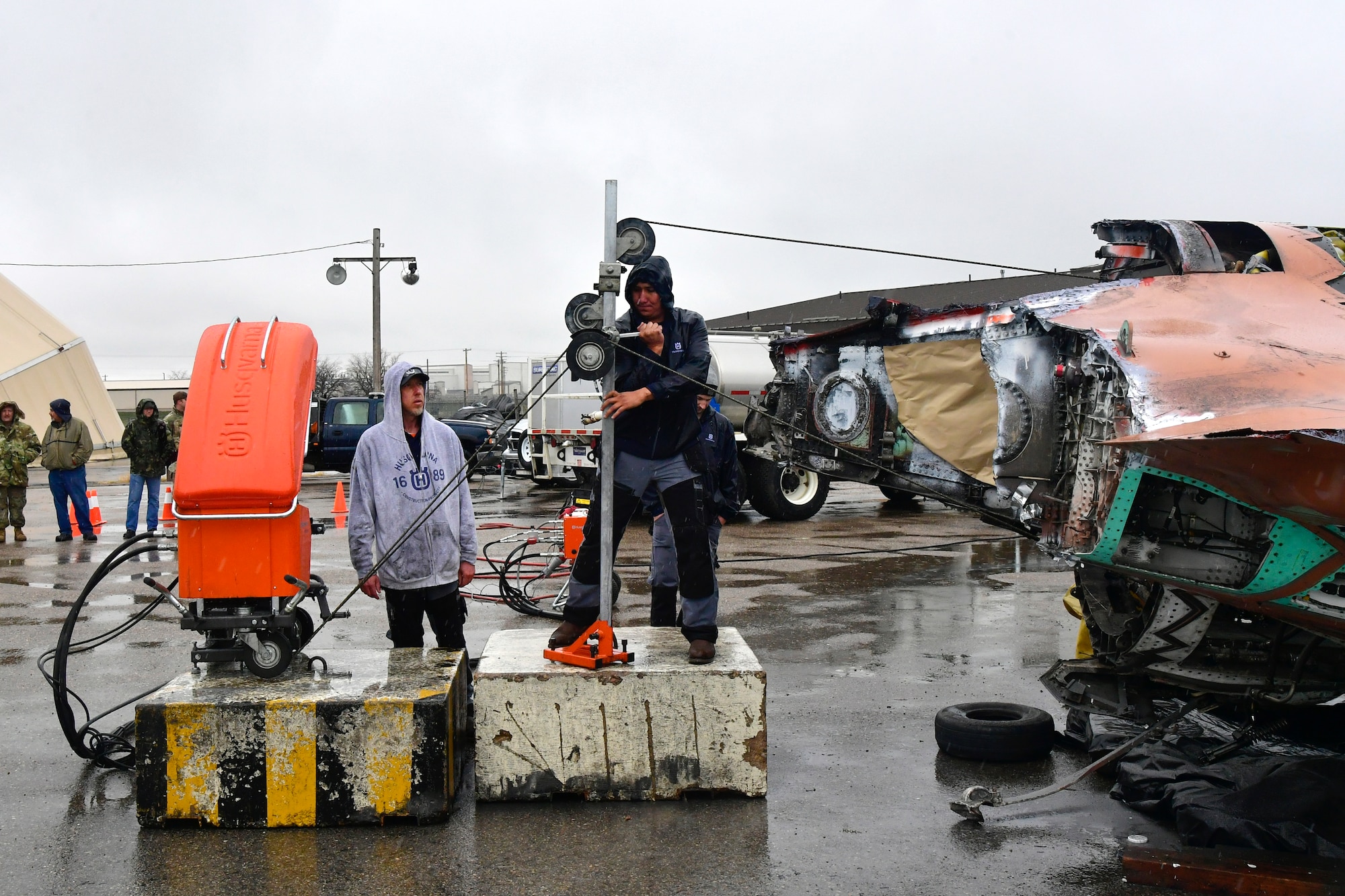 A salvaged F-35A is cut in half with the volunteer help of a civilian saw manufacturing company March 31, 2022, at Hill Air Force Base, Utah. The aircraft was condemned after an accident and is currently being transformed into sectional training aids by the 372nd Training Squadron, Det. 3, for use during instruction of F-35 maintainers. (U.S. Air Force photo by Todd Cromar)