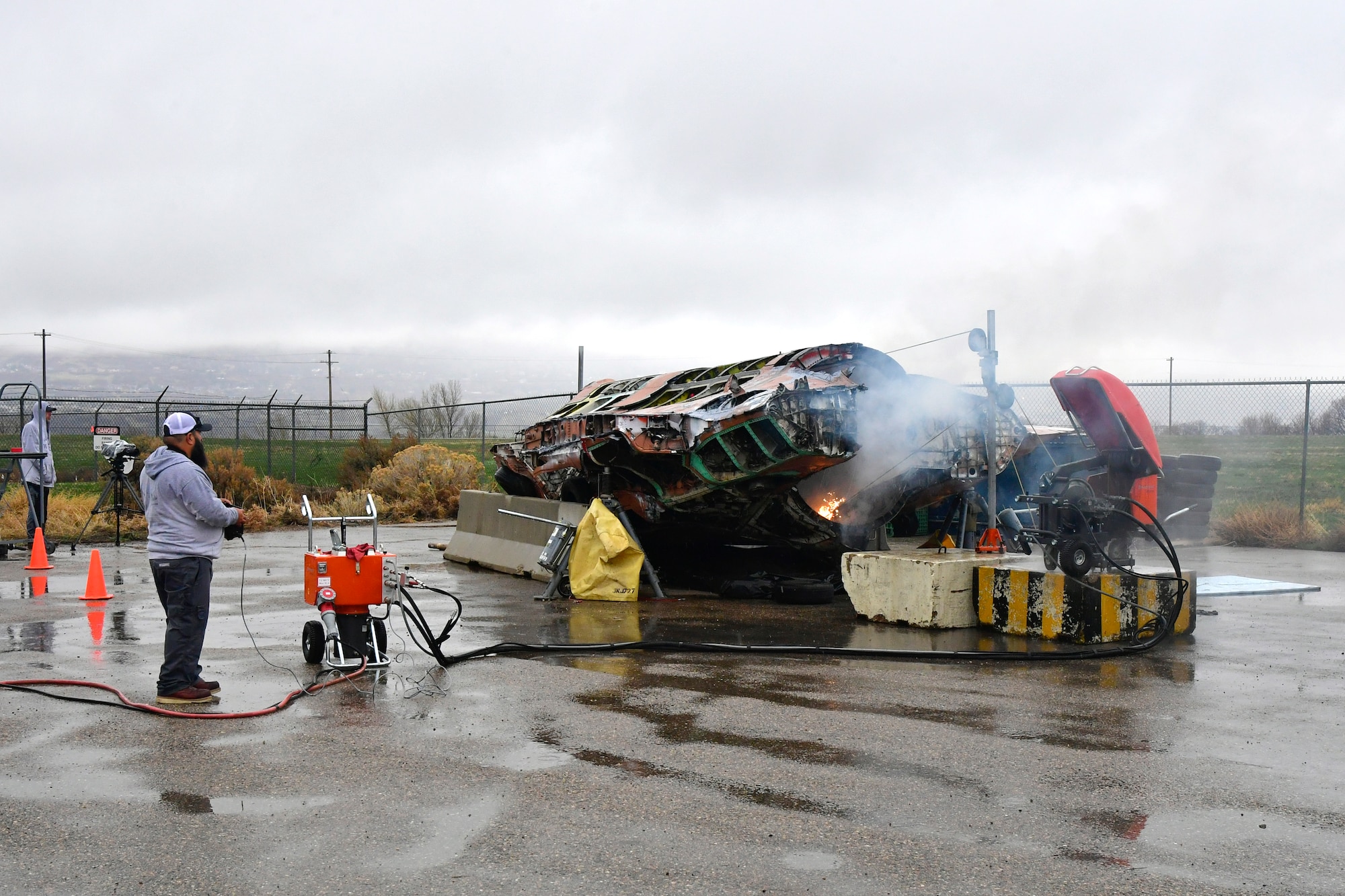 A salvaged F-35A is cut in half with the volunteer help of a civilian saw manufacturing company March 31, 2022, at Hill Air Force Base, Utah. The aircraft was condemned after an accident and is currently being transformed into sectional training aids by the 372nd Training Squadron, Det. 3, for use during instruction of F-35 maintainers. (U.S. Air Force photo by Todd Cromar)