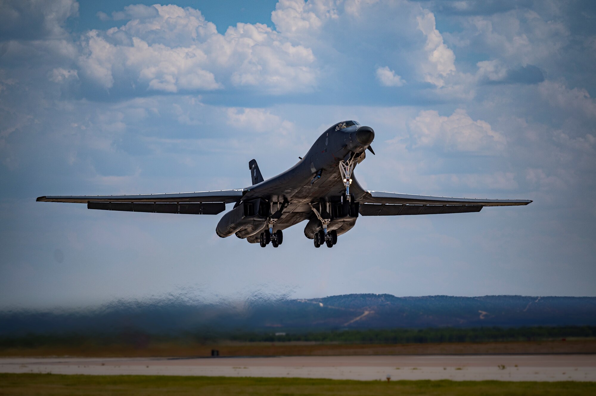 A B-1B Lancer bomber takes off from Dyess Air Force Base, Texas, June 29, 2022 to support Exercise African Lion as well as conduct counter-illicit maritime activity with Mauritanian Navy vessels off the coast of Mauritania. Supporting Bomber Task Force Conus-to-Conus missions enhance bomber aviators' abilities and build relationships and interoperability with partner nations. (U.S. Air Force photo by Senior Airman Colin Hollowell)