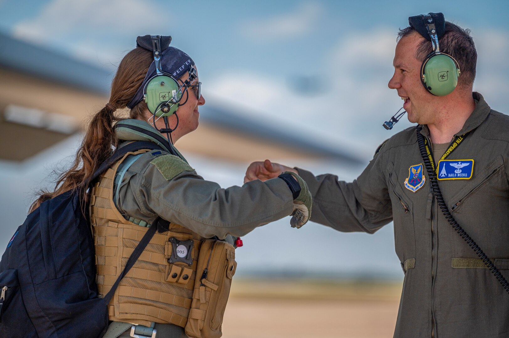 Capt. Erika Tucker, 9th Bomb Squadron pilot, greets Capt. Dustin Weeks, 7th Operations Group executive officer, after conducting pre-flight checks on a B-1B Lancer at Dyess Air Force Base, Texas, June 30, 2022. The U.S. Department of Defense builds partnerships through focused activities such as senior leader engagements, security force assistance, and cooperation, and multi-national exercises. (U.S. Air Force photo by Senior Airman Colin Hollowell)