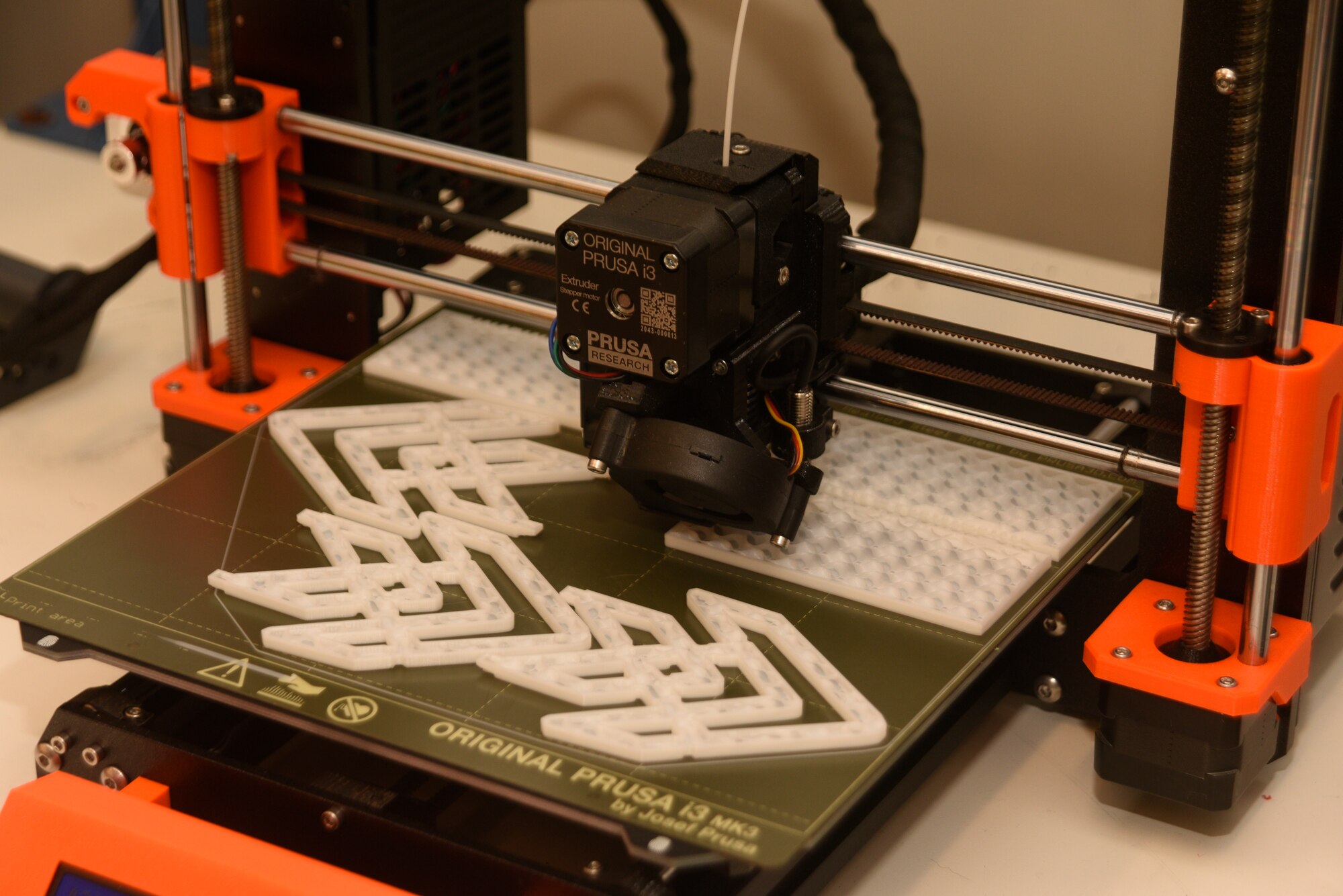 A 3D printer at The Forge, Space Launch Delta 45’s innovation hub at Patrick Space Force Base, Fla., uses a polylactic acid filament to produce decals and other items, June 29, 2022. The Forge has three 3D printers it uses to create a variety of items needed to support the space launch mission. (U.S. Space Force photo by Tech. Sgt. James Hodgman)