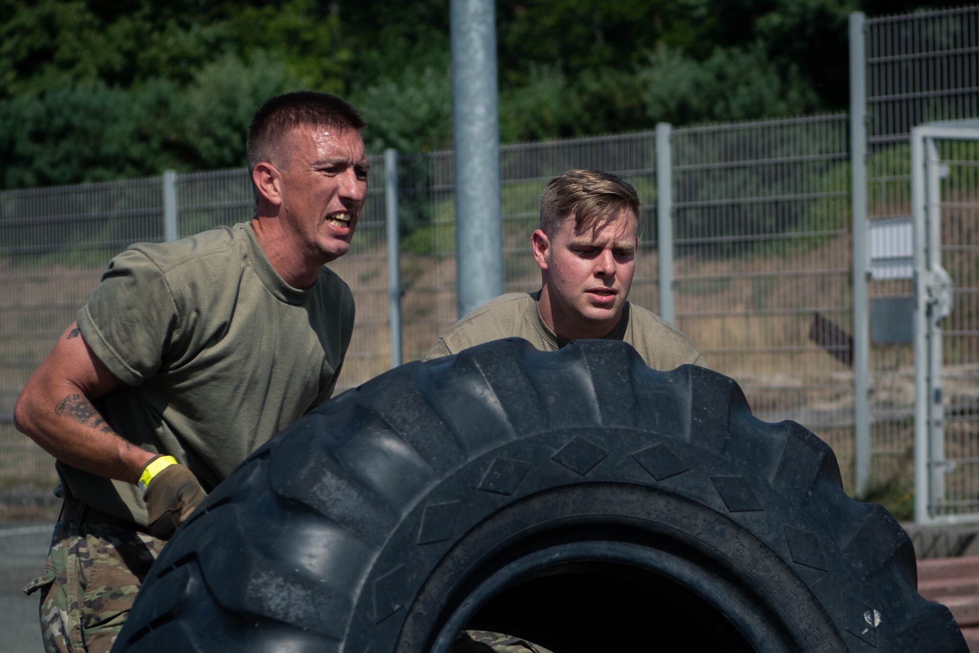 Airmen work as a team to complete an endurance course