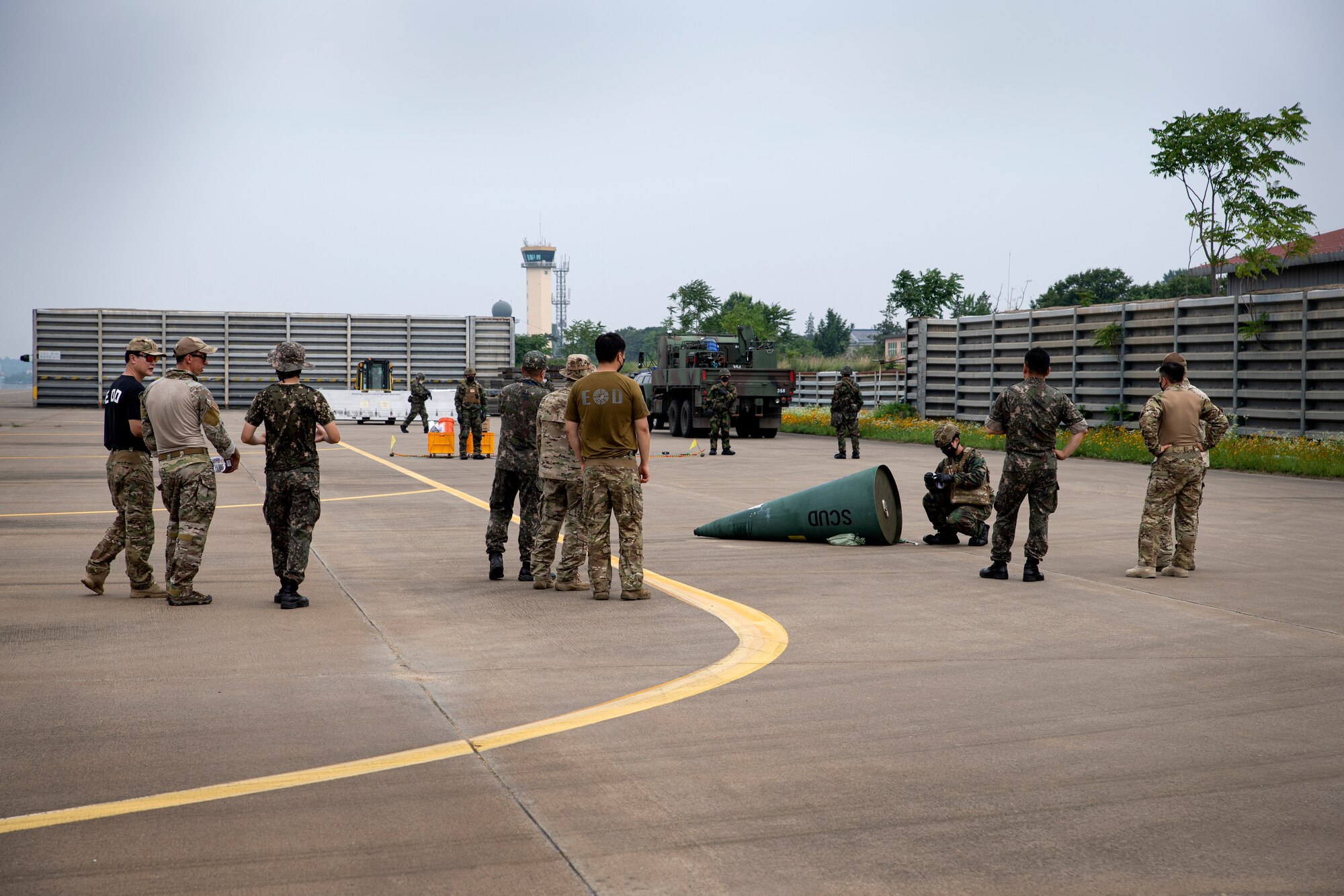 U.S. Air Force members assigned to the 35th Civil Engineer Squadron, Explosive Ordnance Disposal (EOD) flight from Misawa Air Base, Japan, observe Republic of Korea Air Force (ROKAF) EOD members respond to a chemical weapon scenario as part of a bilateral training conducted at Suwon Air Base, Republic of Korea, July 6, 2022.