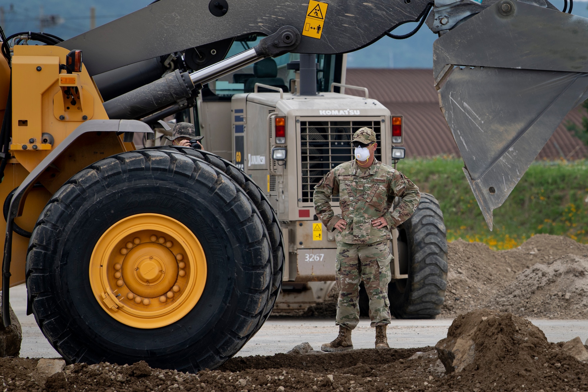 Master Sgt. Marcus Hines, 35th Civil Engineer Squadron, horizontal repair shop superintendent from Misawa Air Base, Japan, observes members of the Republic of Korea Air Force while they practice conducting runway repairs during a bilateral training scenario at Suwon Air Base, Republic of Korea, July 6, 2022.