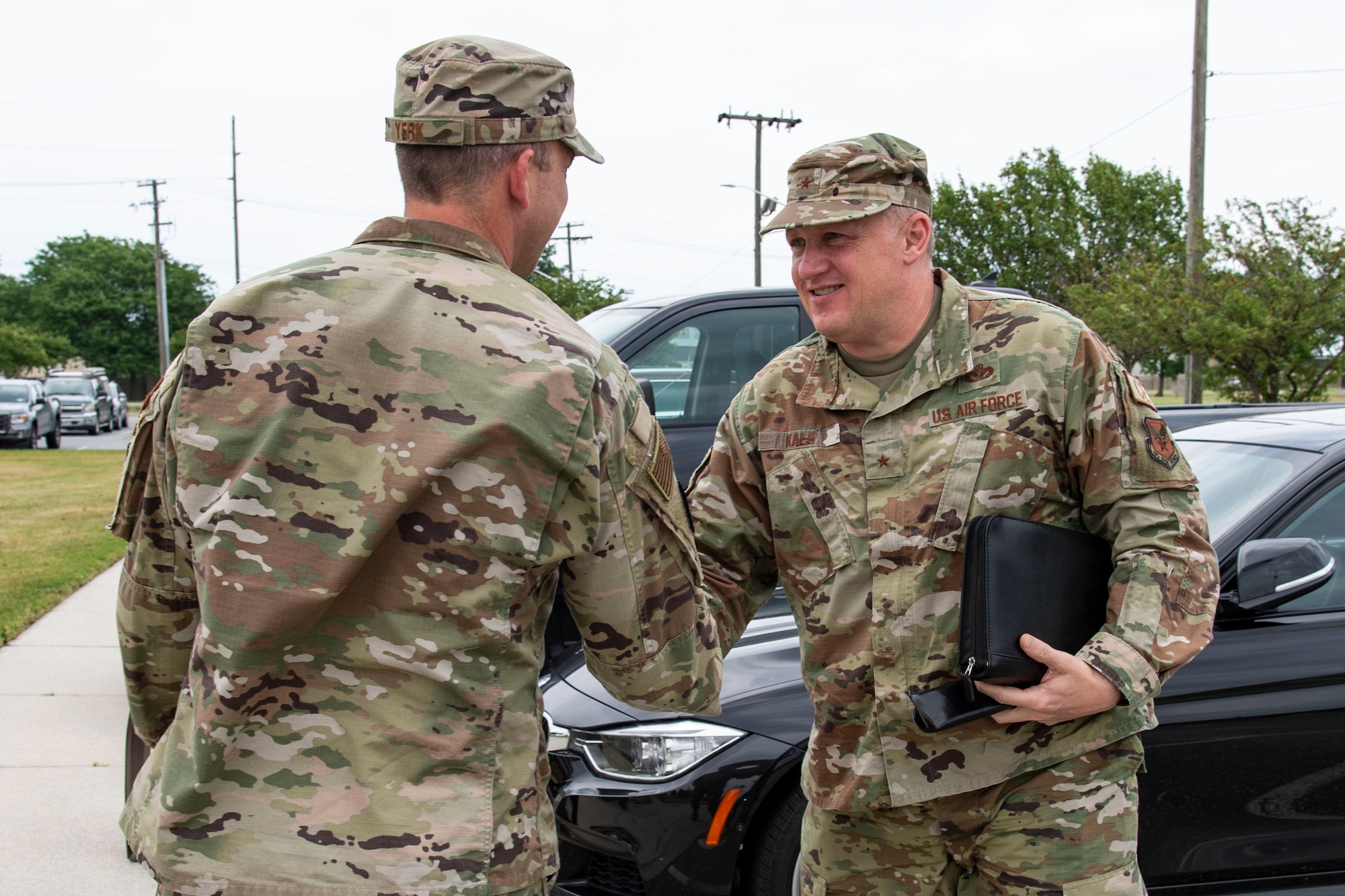 Brig. Gen. William H. Kale III, right, Air Force Director of Civil Engineers, Deputy Chief of Staff for Logistics, Engineering and Force Protection, Headquarters U.S. Air Force, the Pentagon, Arlington, Virginia, is greeted by Lt. Col. Joshua Yerk, left, 436th Civil Engineer Squadron commander, during a visit to Dover Air Force Base, Delaware, July 5, 2022. Kale is responsible for providing policy and oversight for the planning, development, construction, maintenance, utilities and environmental quality of 176 Air Force bases worldwide valued at more than $420 billion. This responsibility includes housing, fire emergency services, explosive ordnance disposal and emergency management services. (U.S. Air Force photo by Roland Balik)