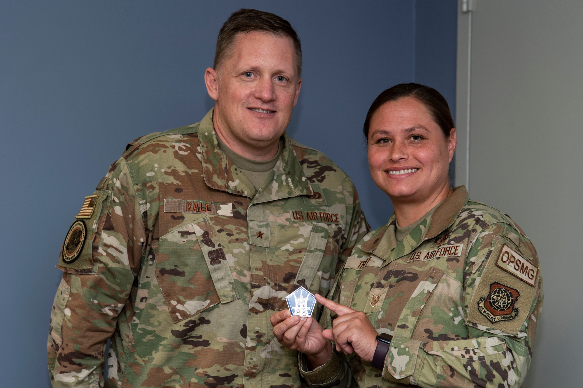 Brig. Gen. William H. Kale III, left, Air Force Director of Civil Engineers, Deputy Chief of Staff for Logistics, Engineering and Force Protection, Headquarters U.S. Air Force, the Pentagon, Arlington, Virginia, and Tech. Sgt. Heather Truitt, right, 436th Civil Engineer Squadron operations management craftsman, pose for a photo at Dover Air Force Base, Delaware, July 5, 2022. Truitt was coined by Kale after being recognized by 436th CES leadership for her outstanding performance and contributions to the squadron. (U.S. Air Force photo by Roland Balik)