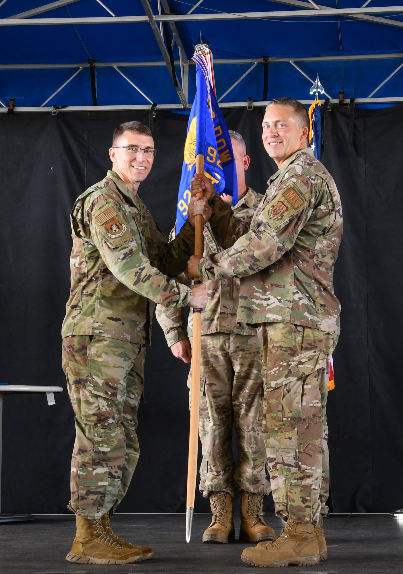 Col. George Cole, 920th Maintenance Group commander, presents a guidon to Maj. Jonathan Crocker, 920th Aircraft Maintenance Squadron commander, during a change of command ceremony here July 9. The 920th AMXS oversees maintenance for the wing’s 10 HH-60G Pave Hawk helicopters. (U.S. Air Force photo by Staff Sgt. Darius Sostre-Miroir)