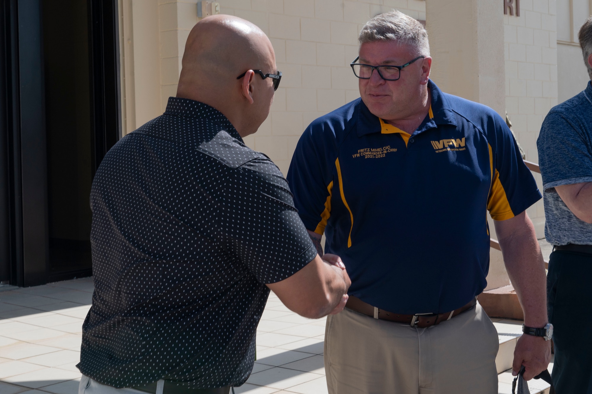 Two men shaking hands.
